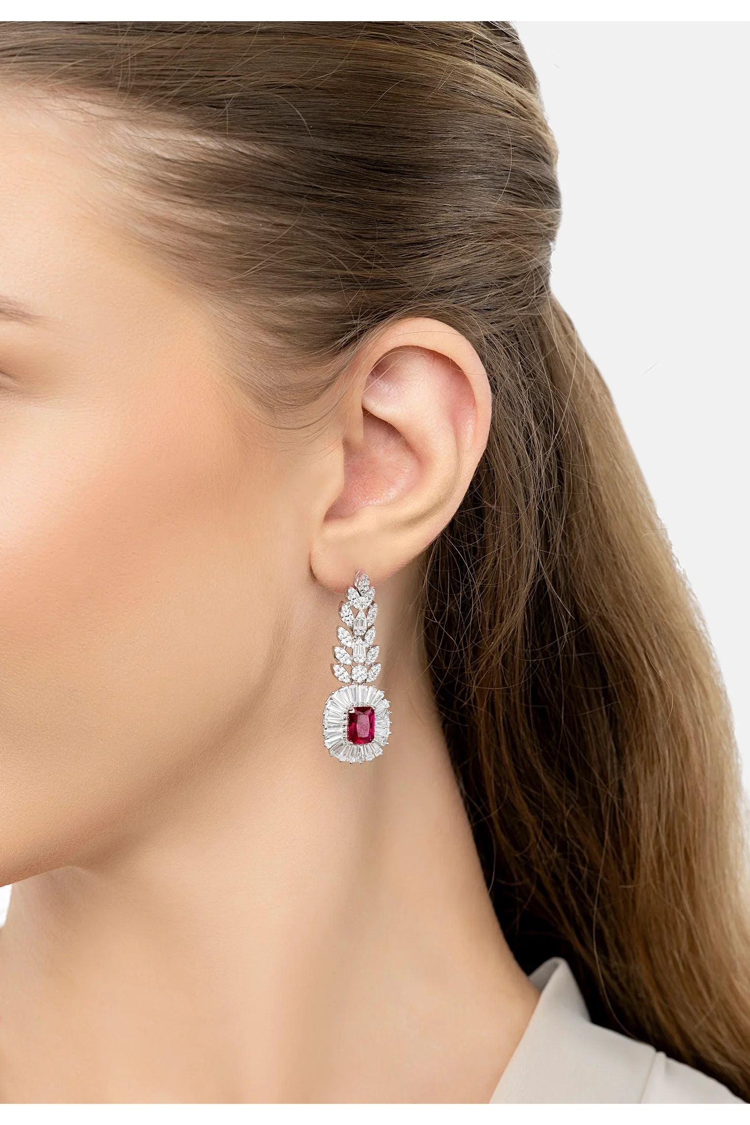 The earring worn by a model.