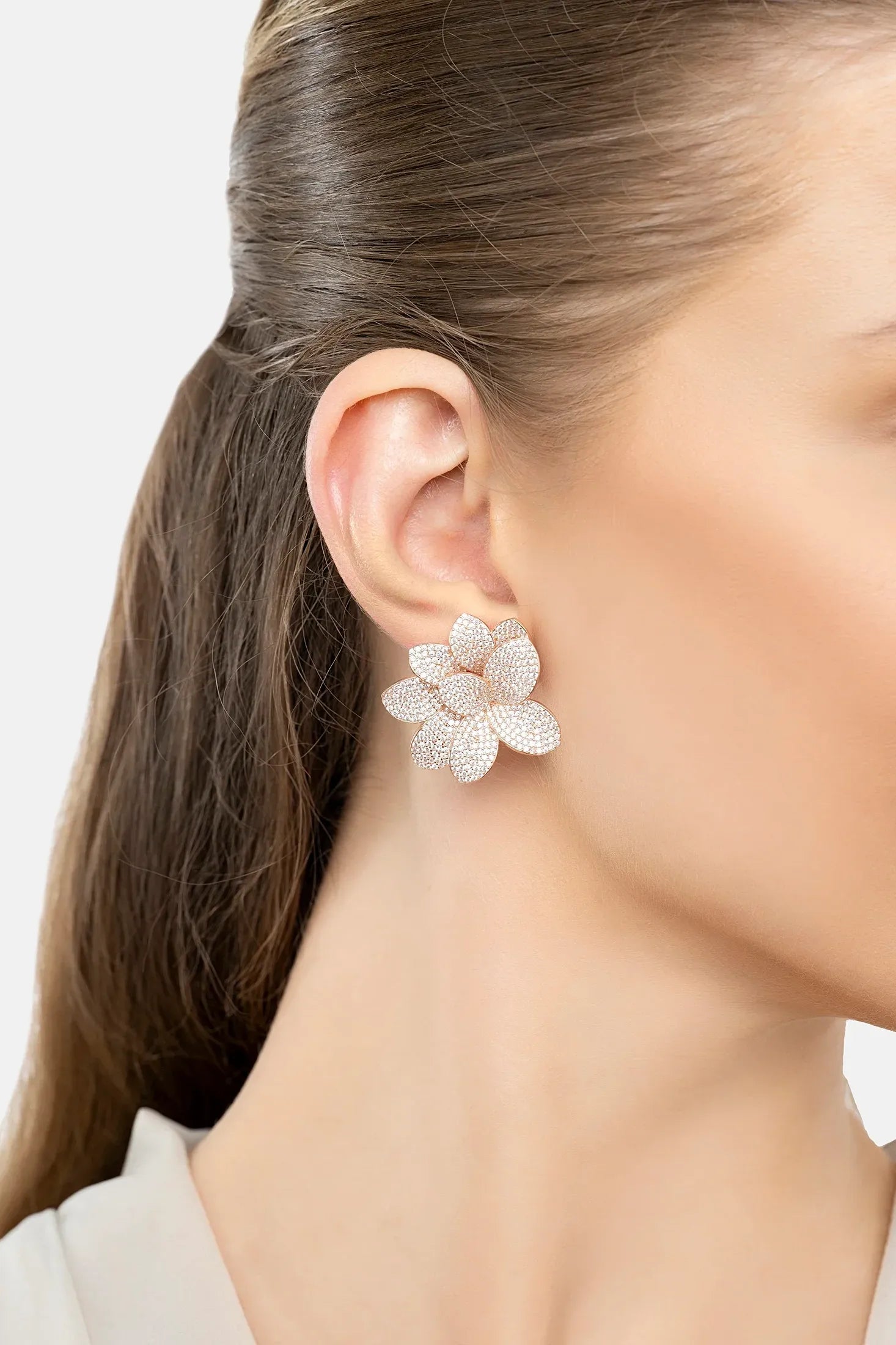 The earring worn by a model.