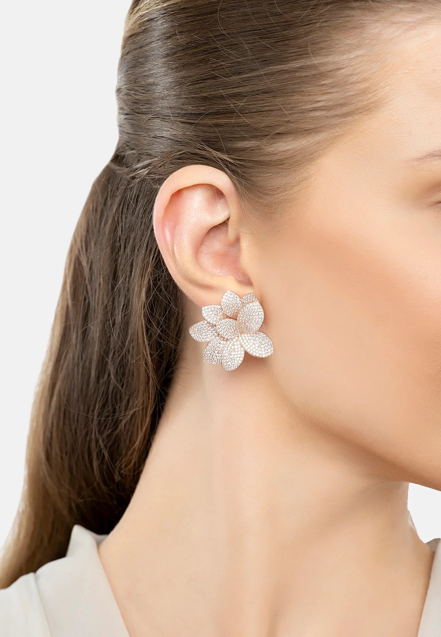 The earring worn by a model.