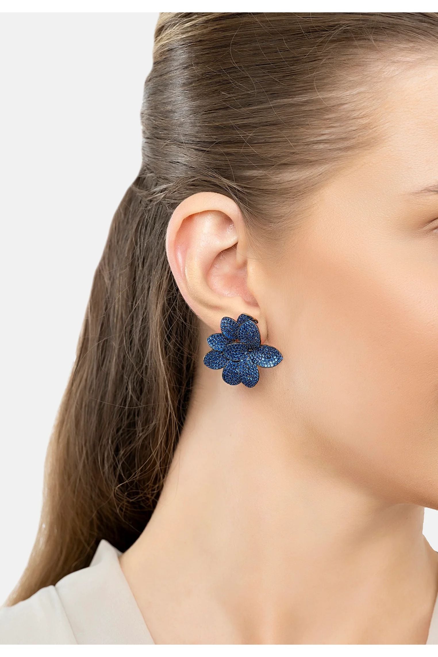 The earring worn by a model.