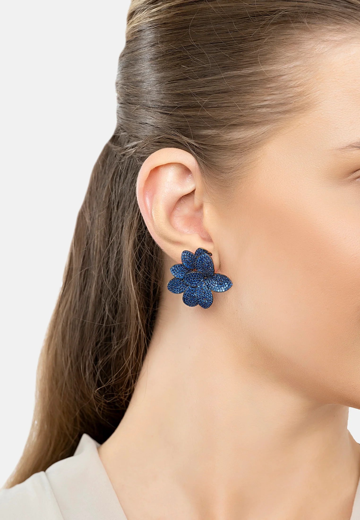 The earring worn by a model.
