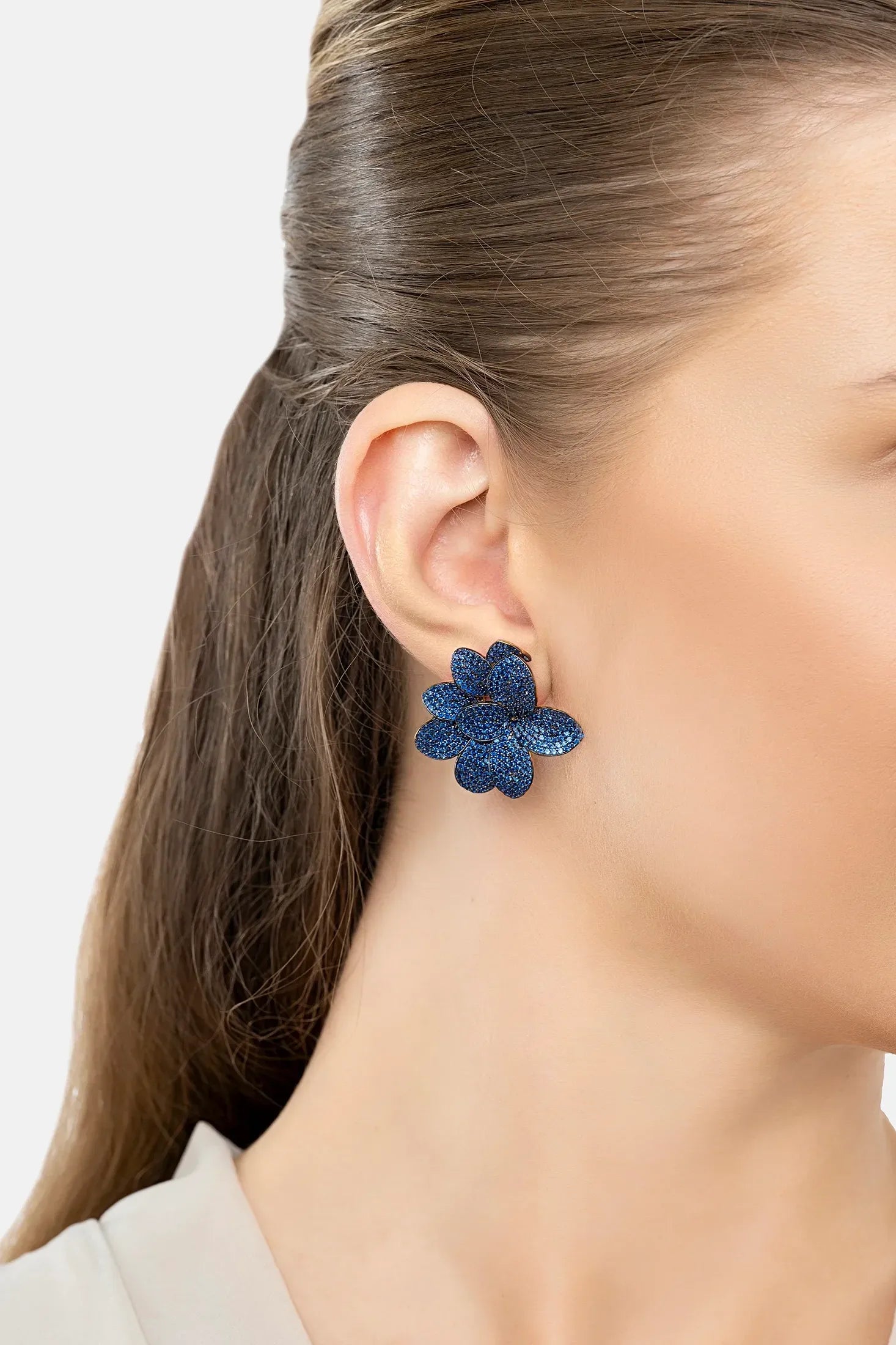 The earring worn by a model.