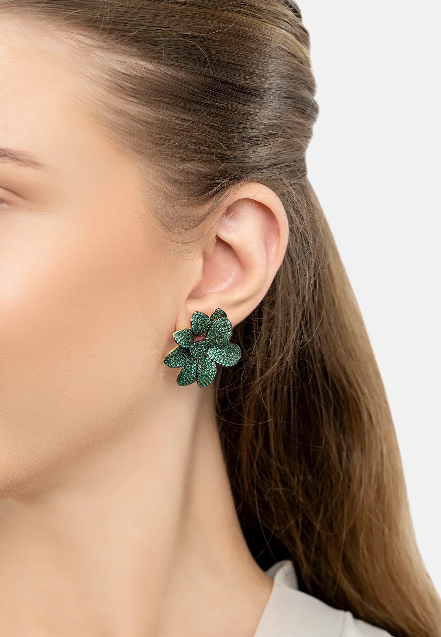 The earring worn by a model.