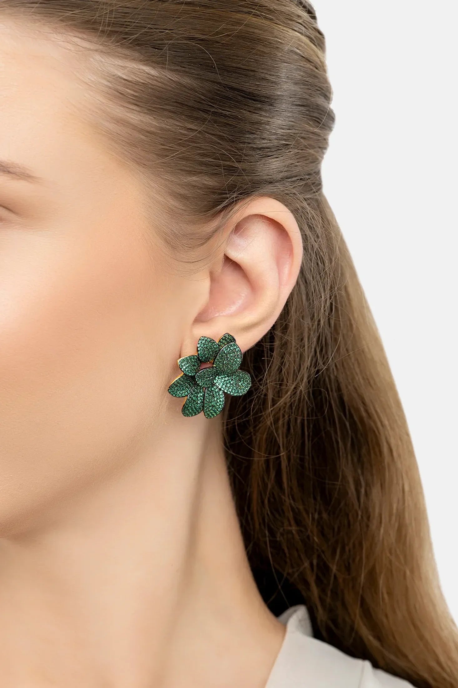 The earring worn by a model.