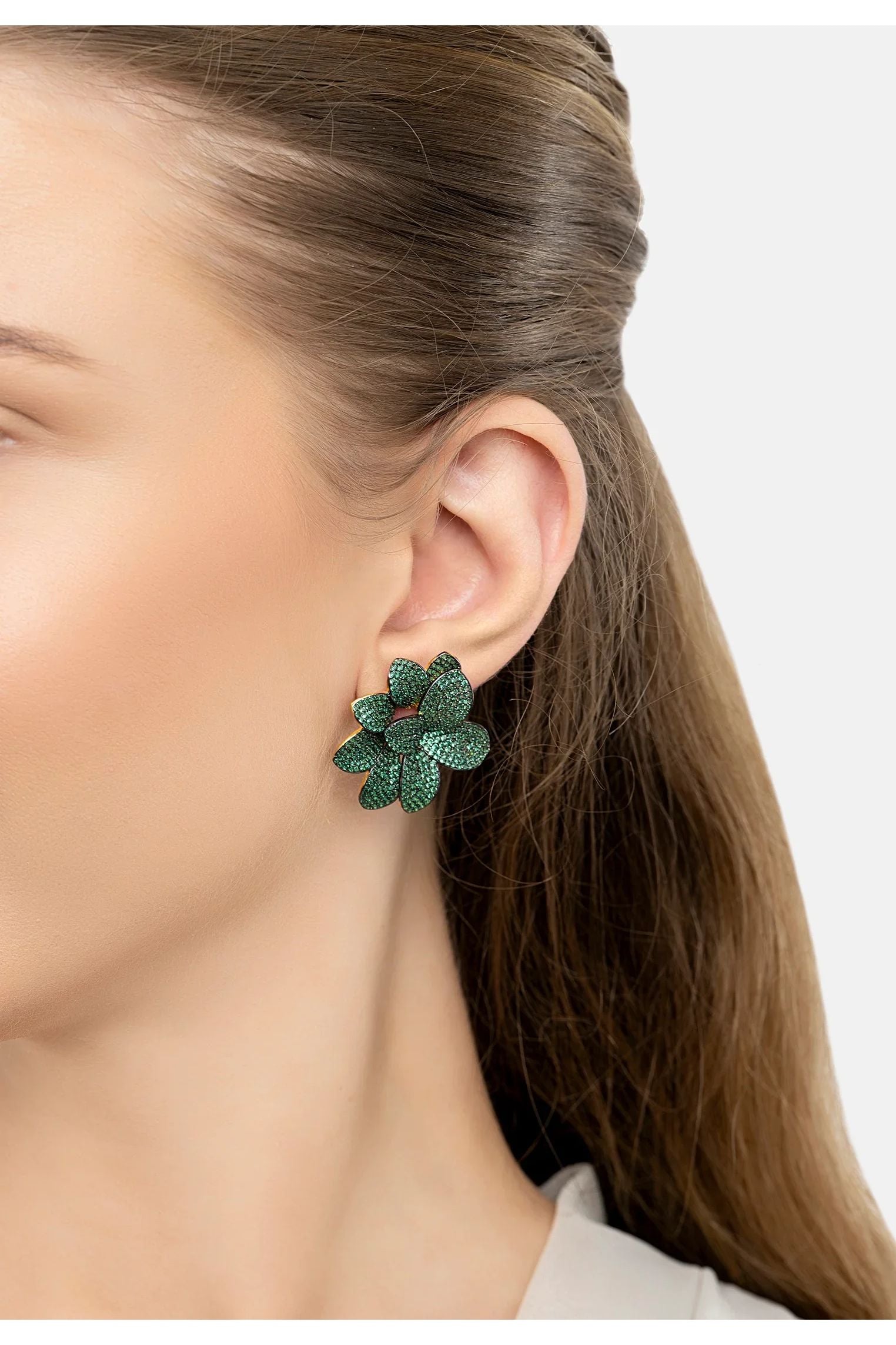 The earring worn by a model.