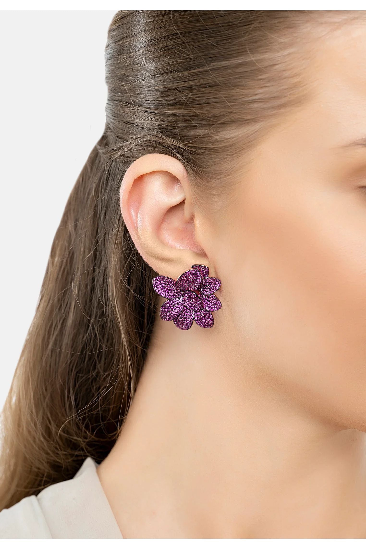 The earring worn by a model.