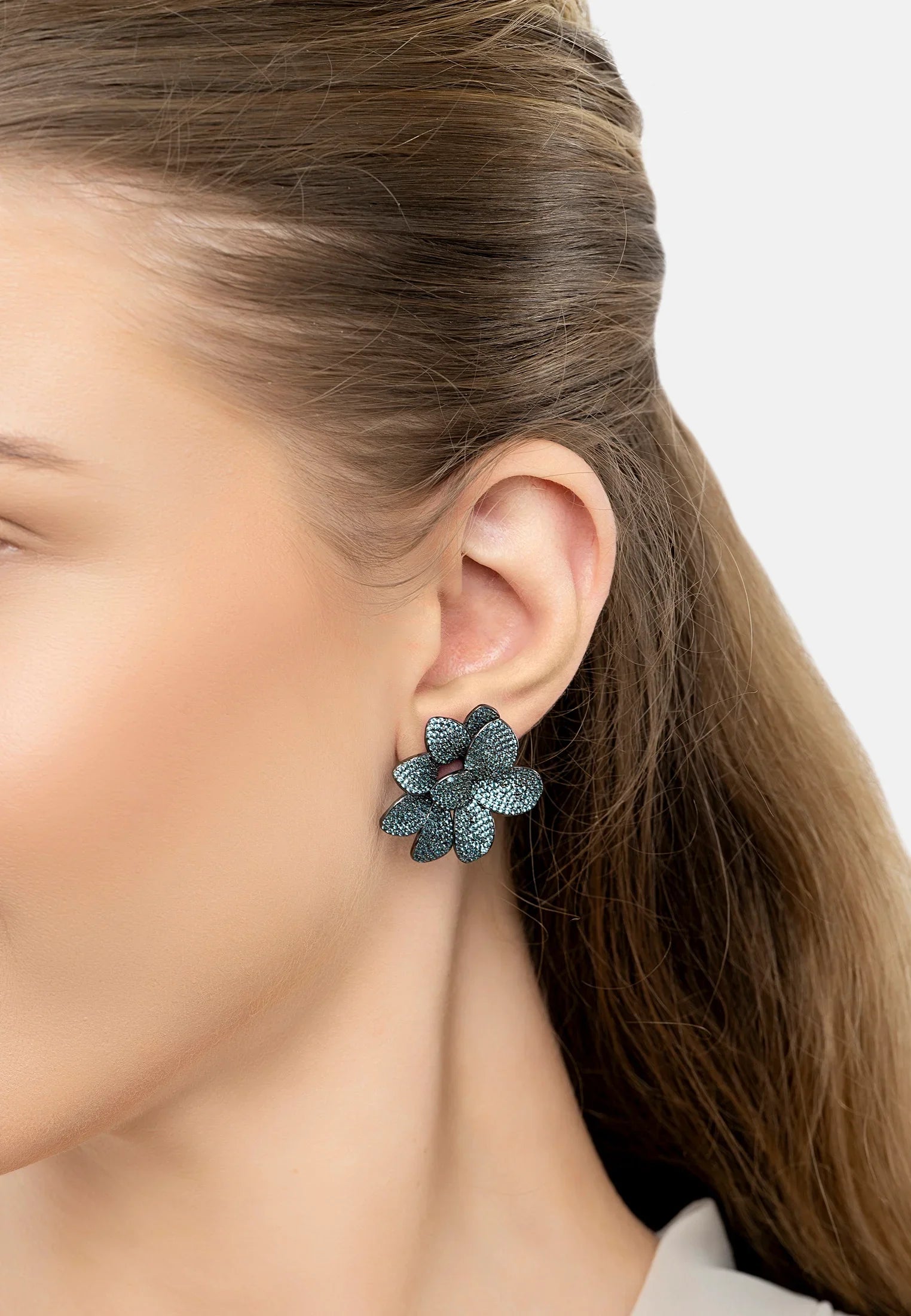 The earring worn by a model.