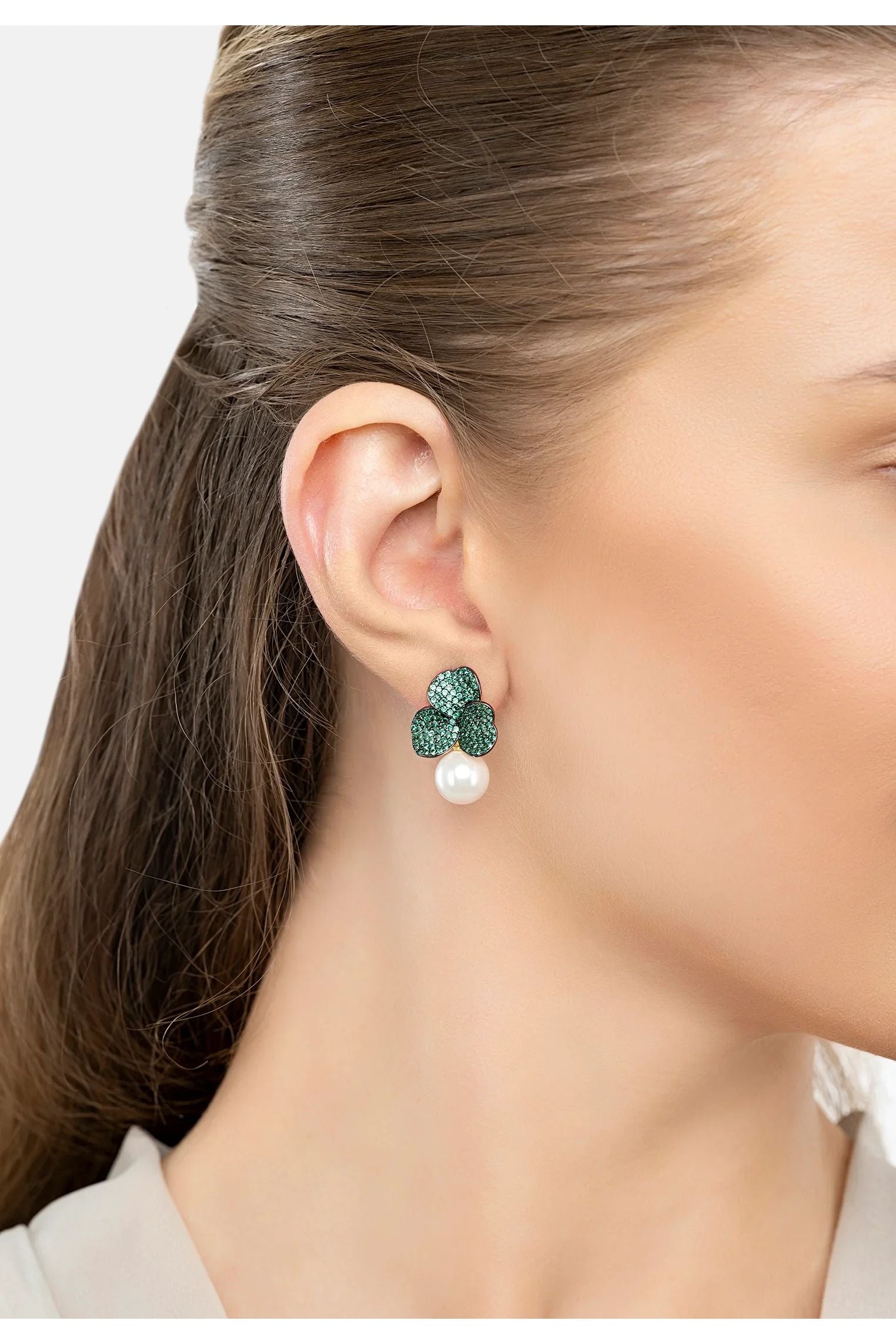 The earring worn by a model.