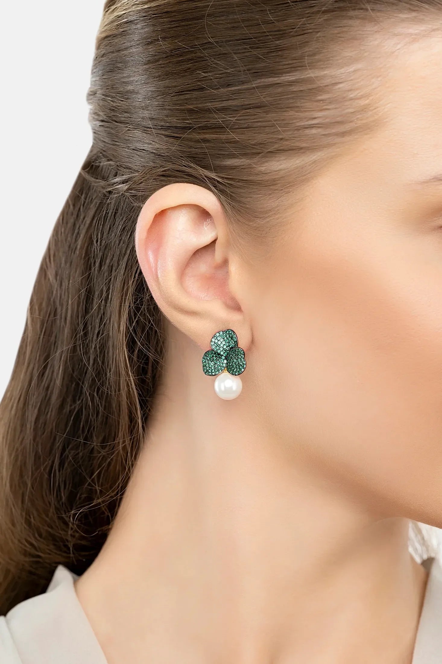 The earring worn by a model.