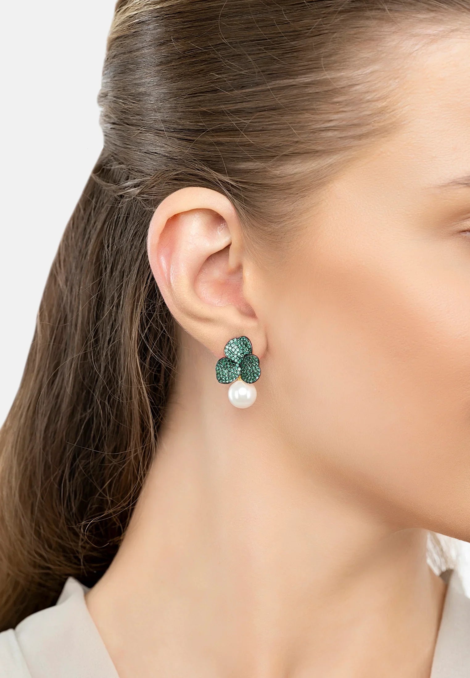 The earring worn by a model.