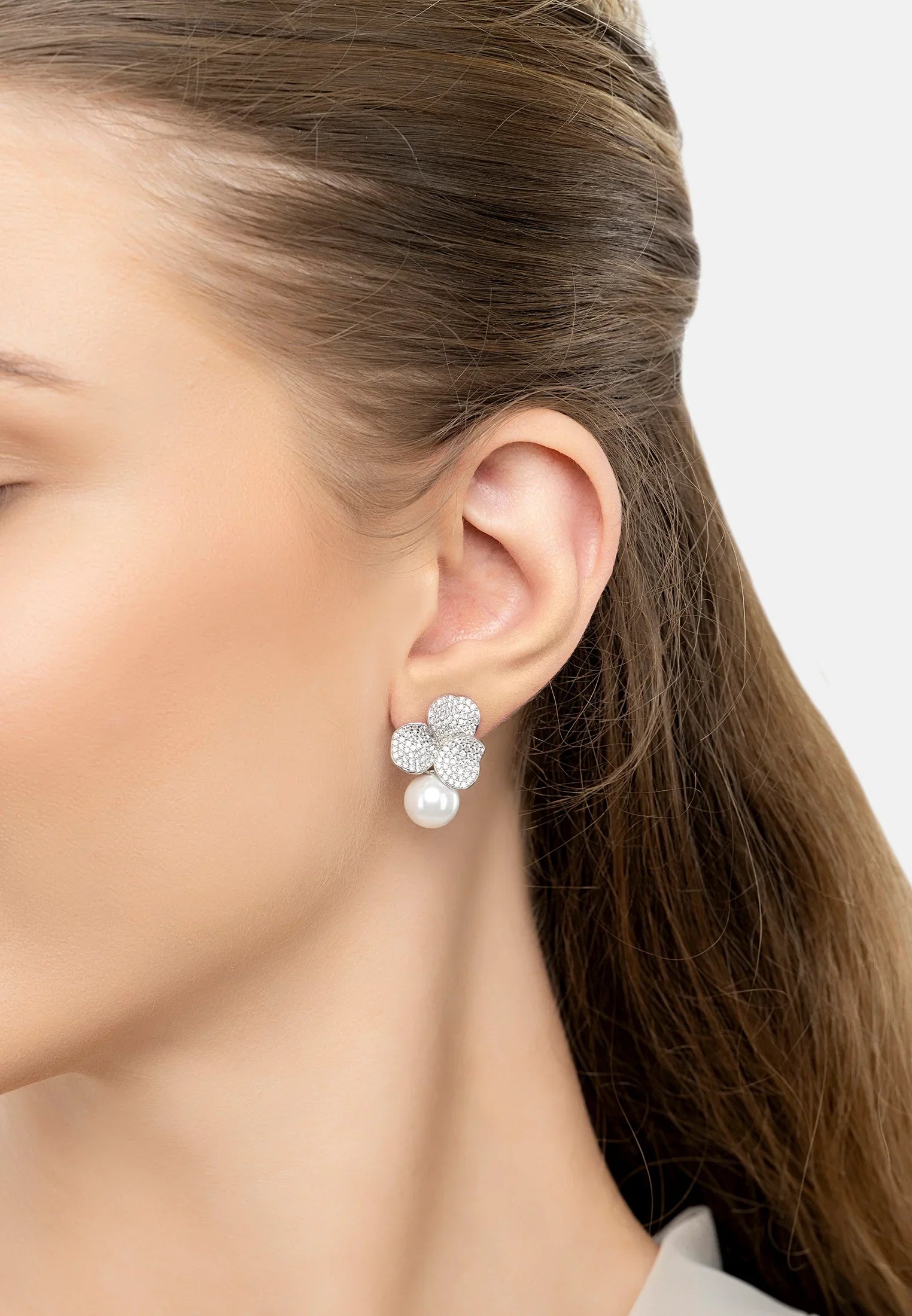The earring worn by a model.