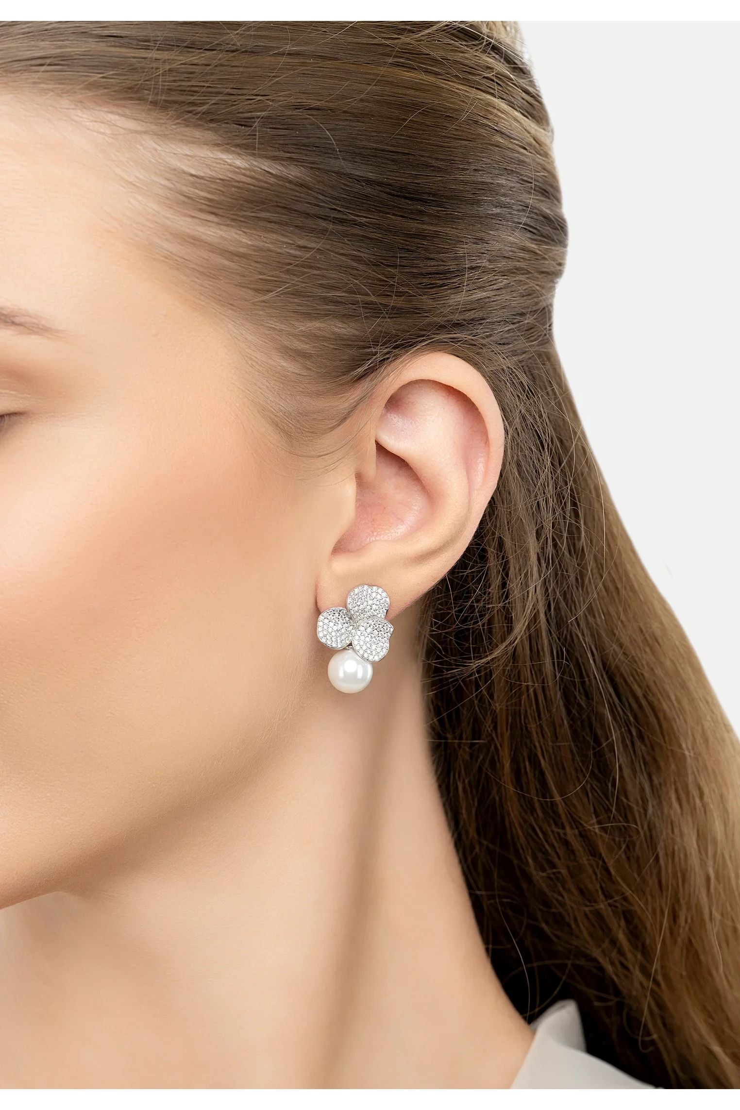 The earring worn by a model.