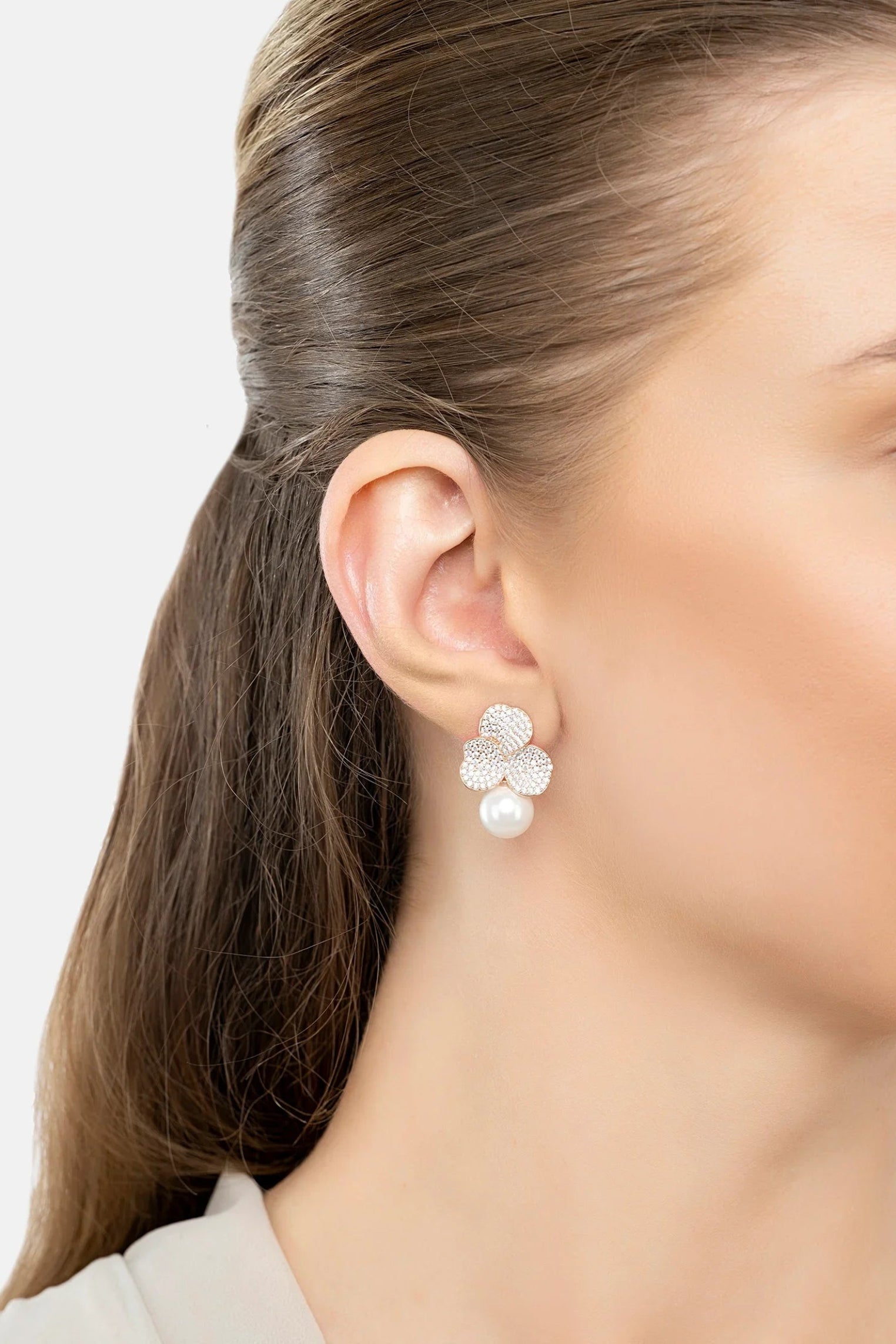 The earring worn by a model.