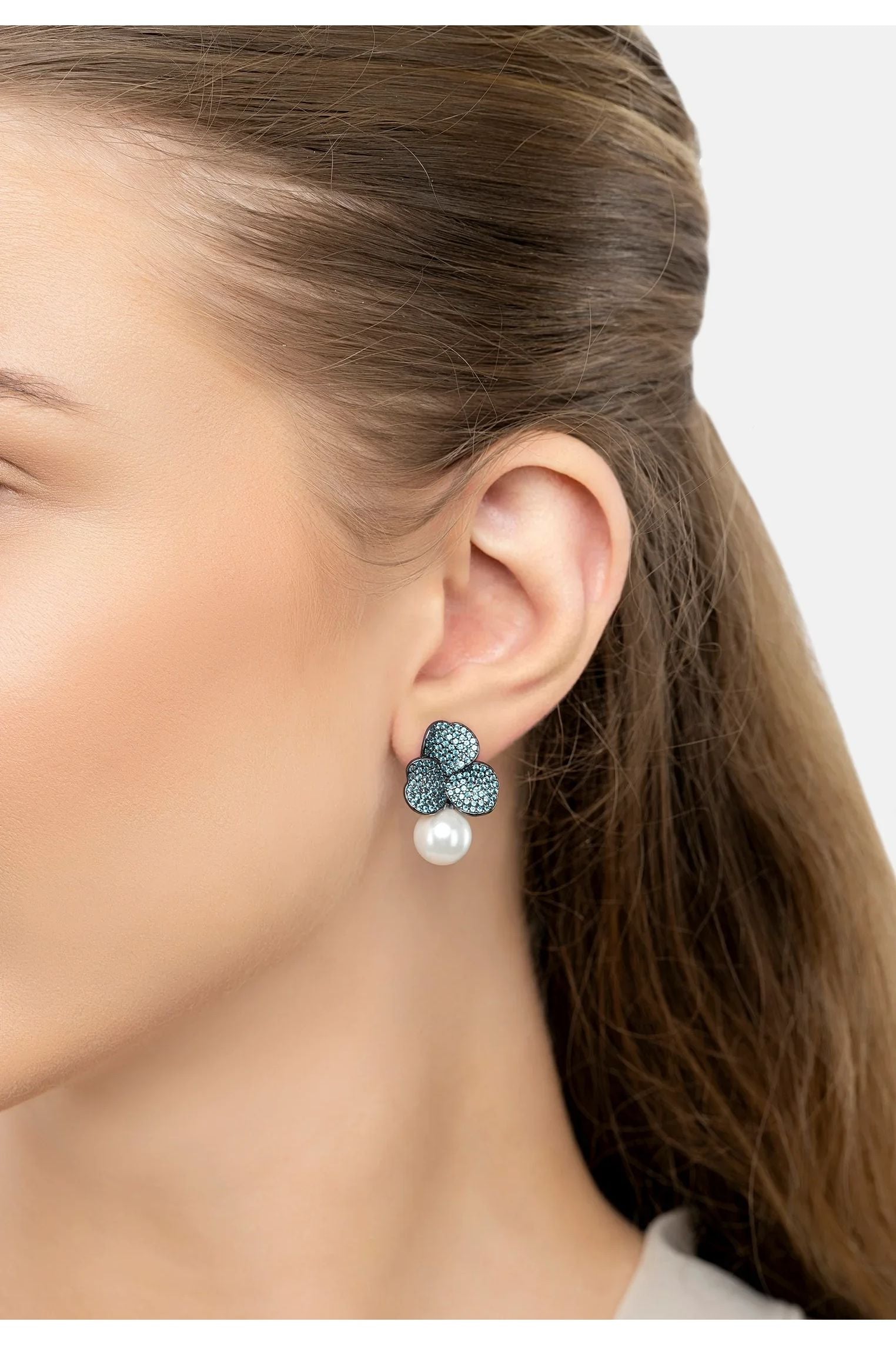 The earring worn by a model.