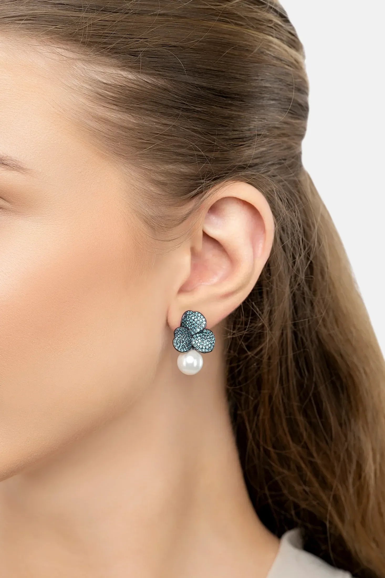 The earring worn by a model.