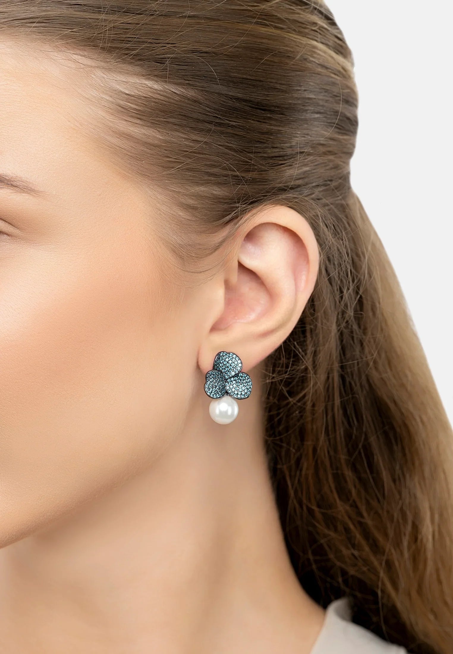 The earring worn by a model.