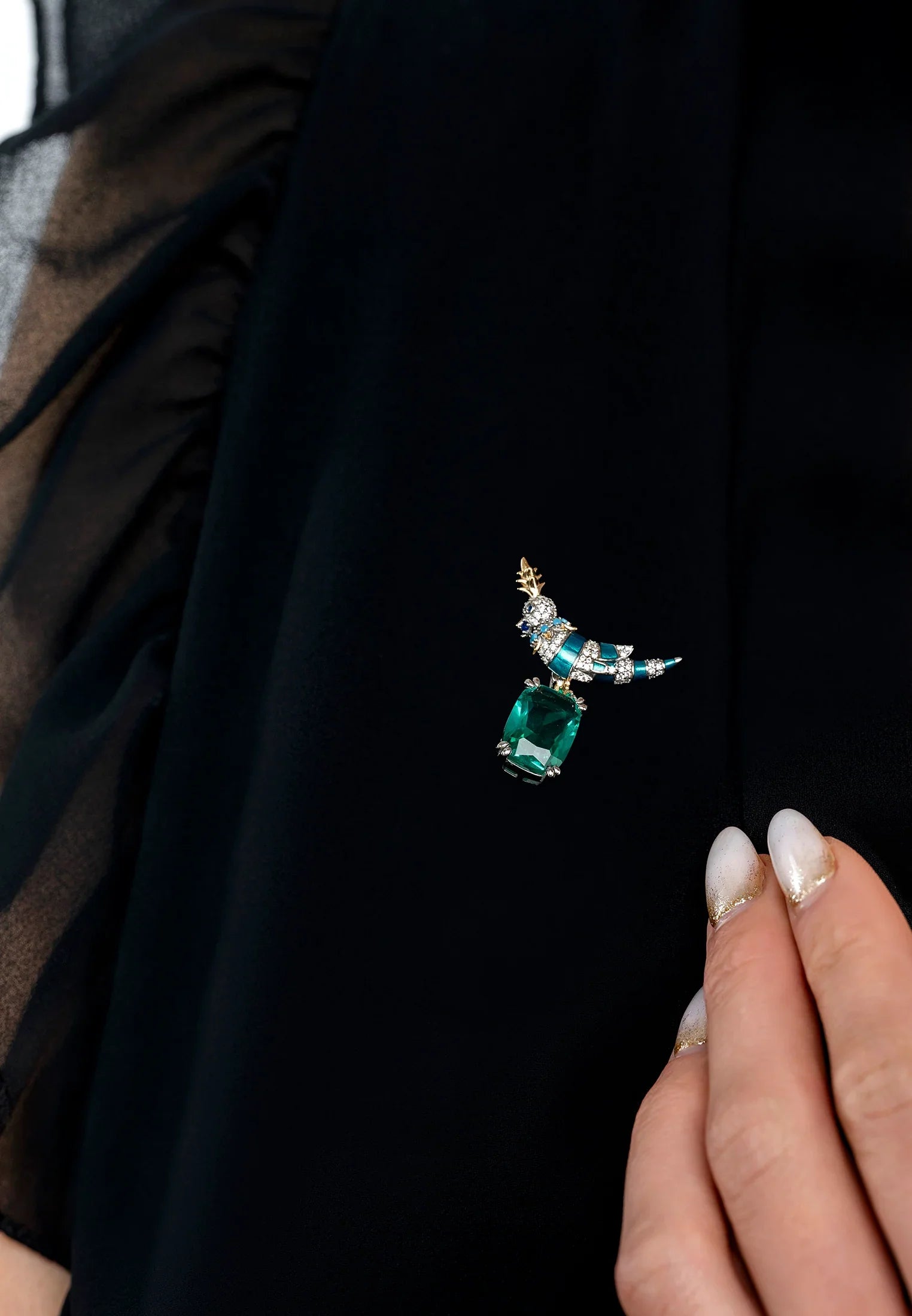 The brooch worn by a model.