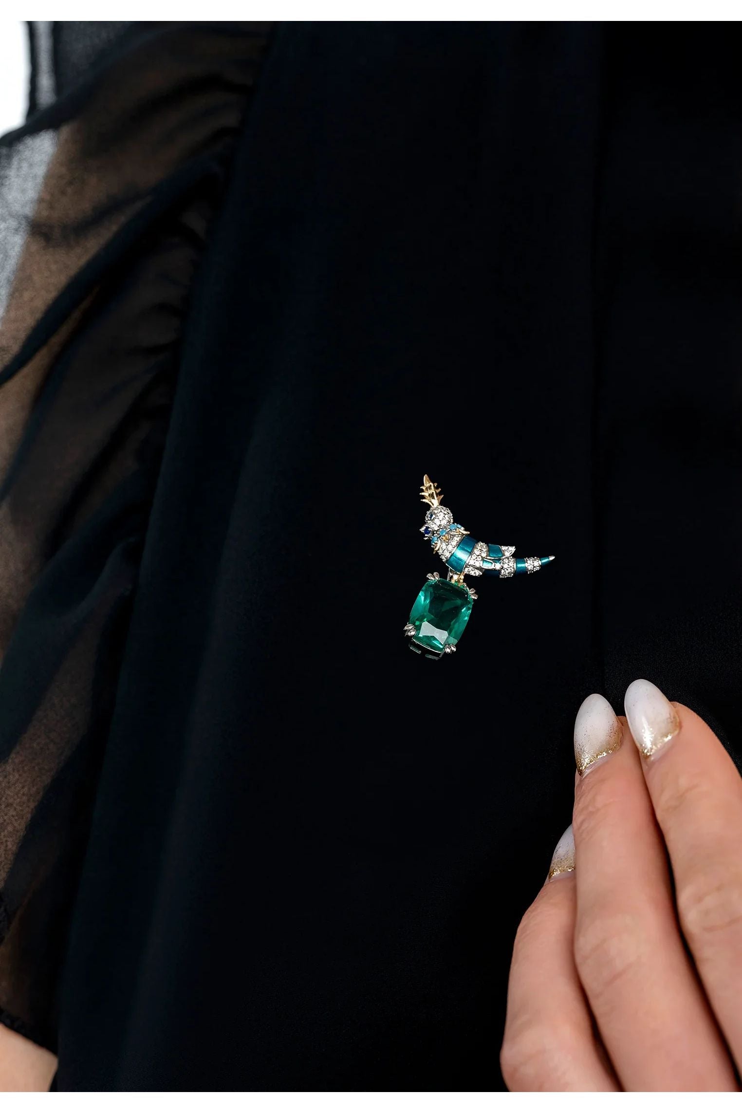 The brooch worn by a model.