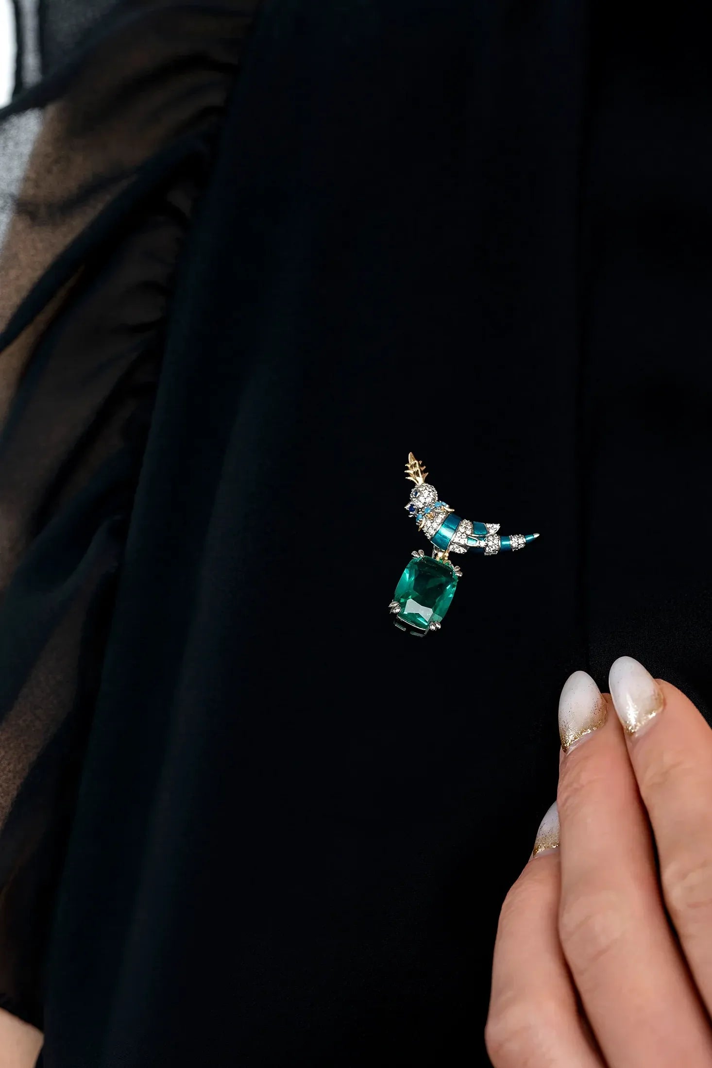 The brooch worn by a model.
