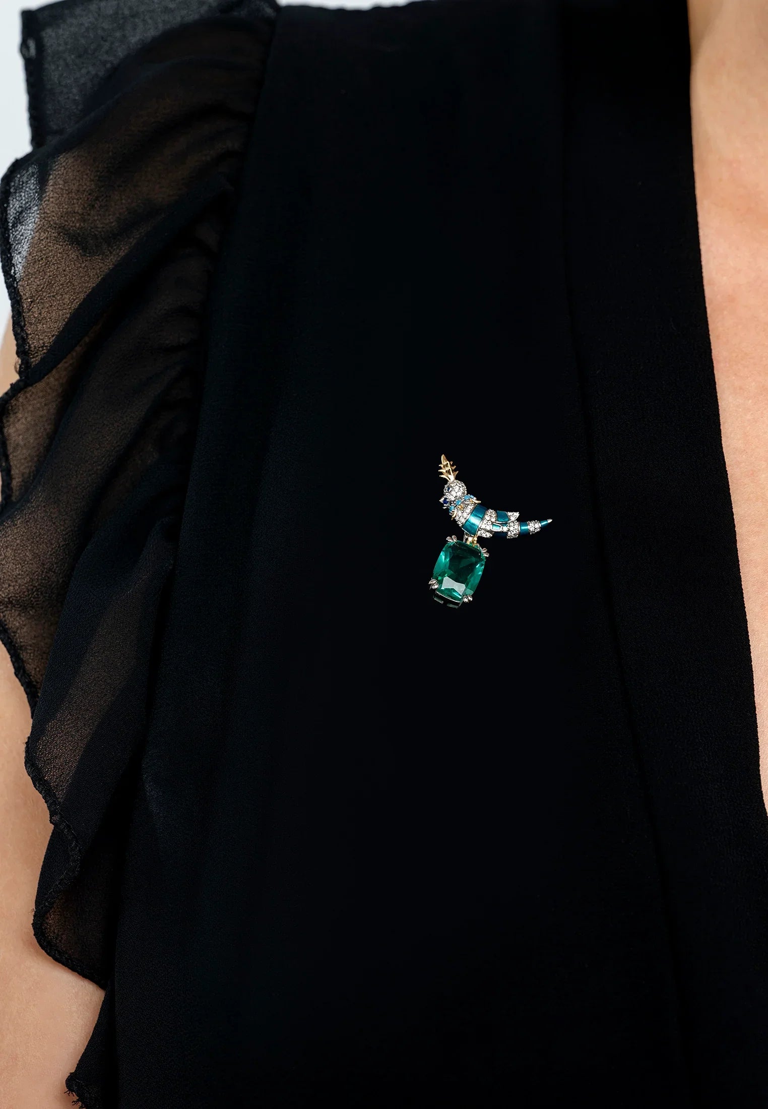 The brooch worn by a model.