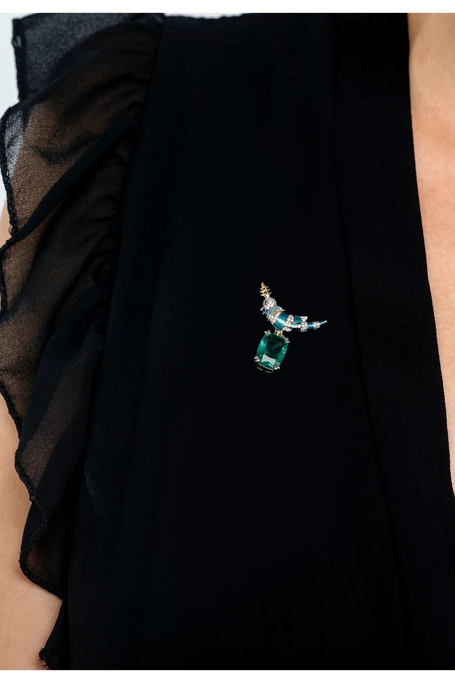 The brooch worn by a model.