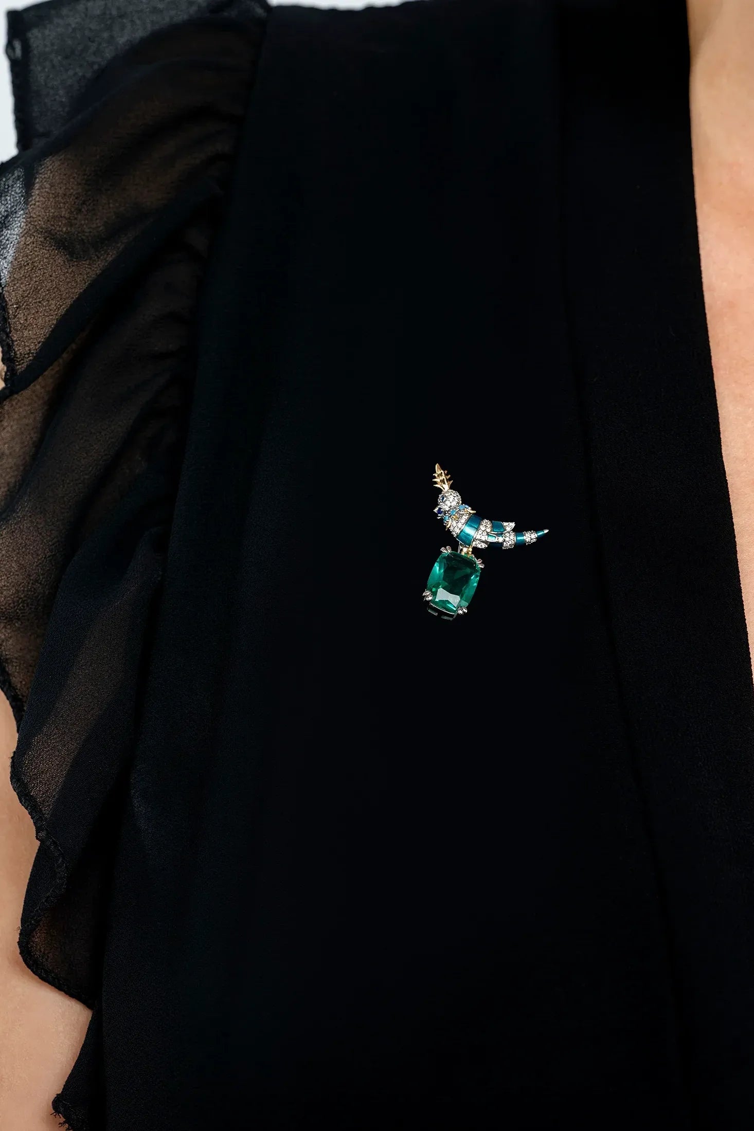The brooch worn by a model.