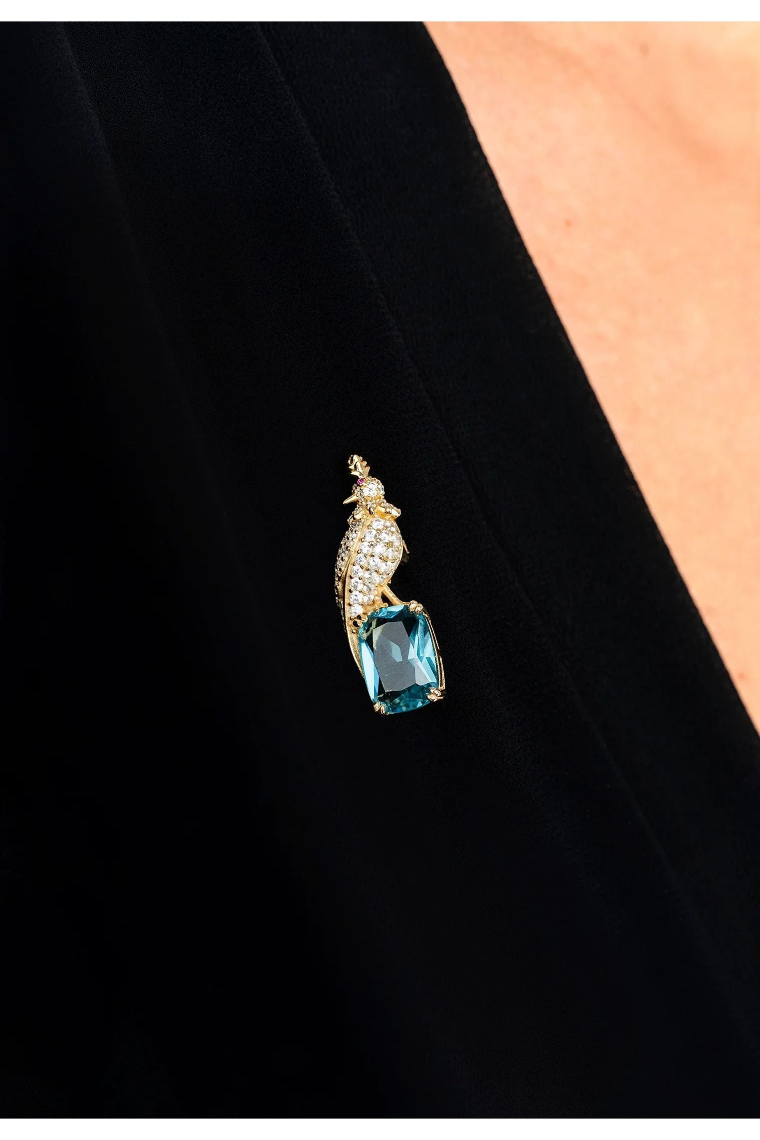 The brooch worn by a model.
