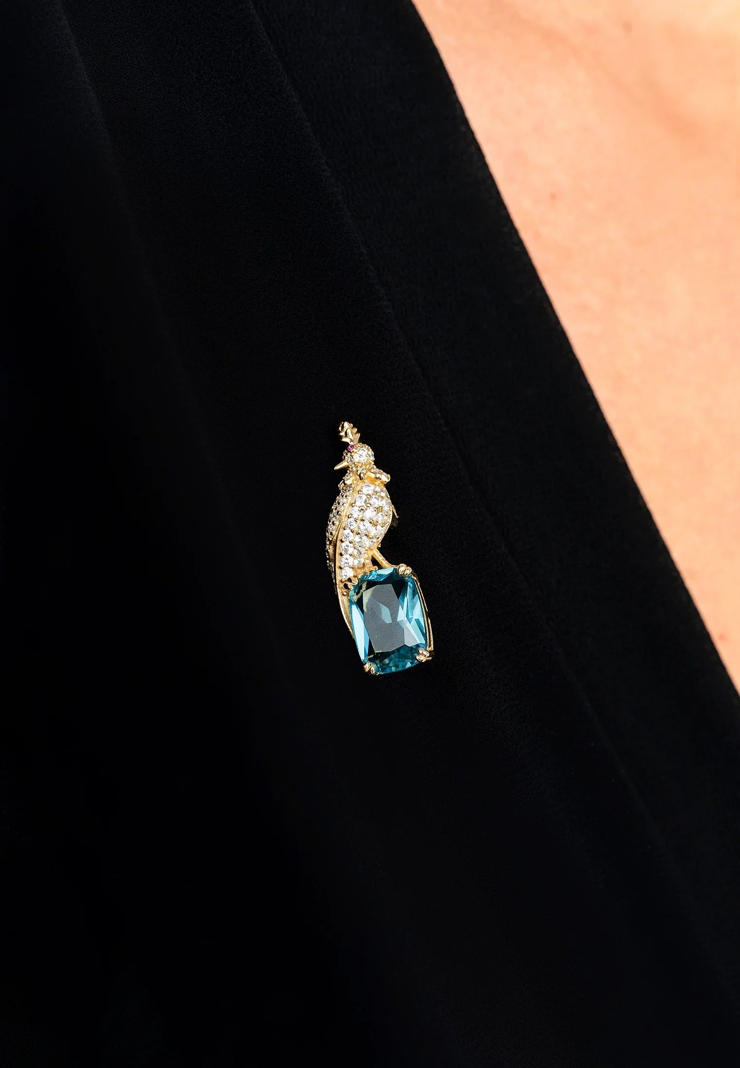 The brooch worn by a model.