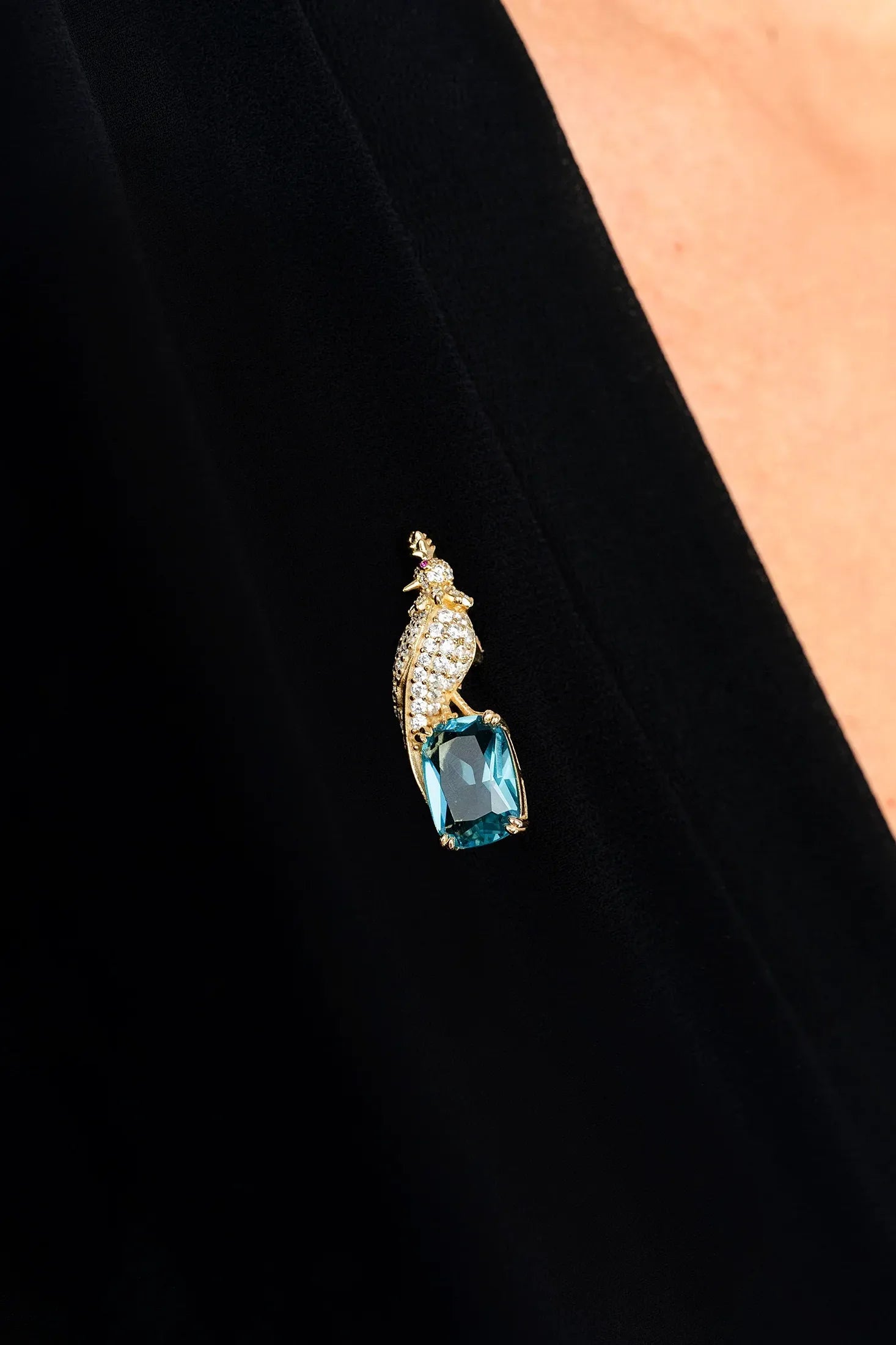 The brooch worn by a model.
