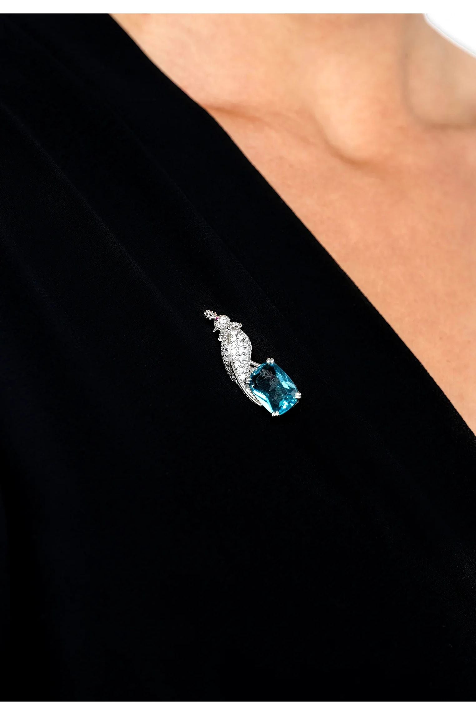 The brooch worn by a model.
