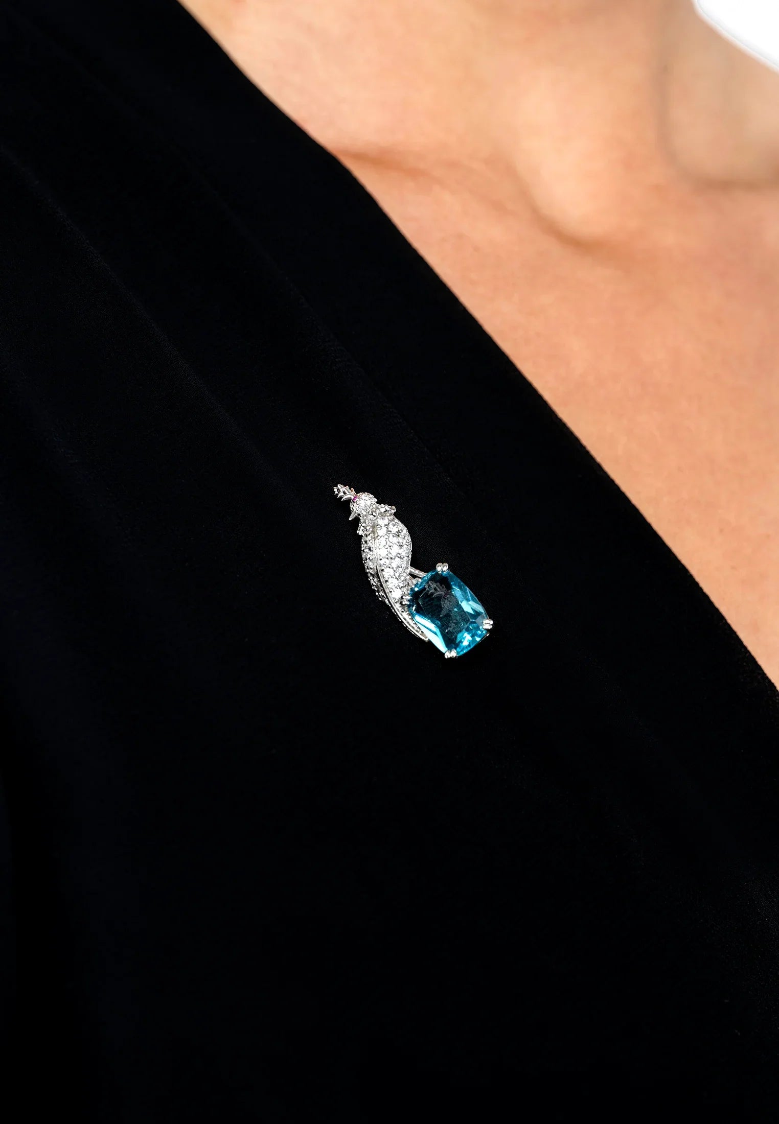 The brooch worn by a model.