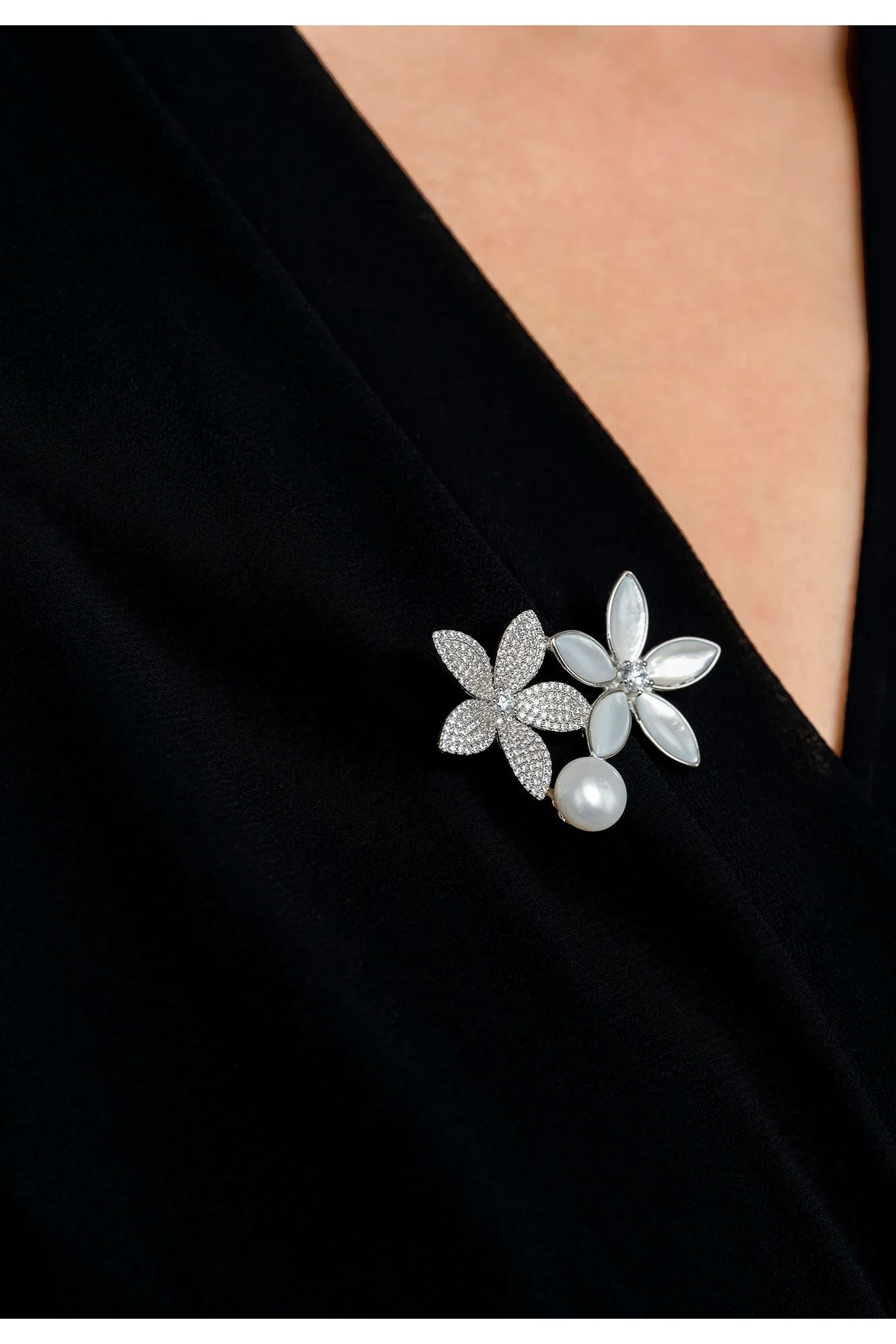 The brooch worn by a model.