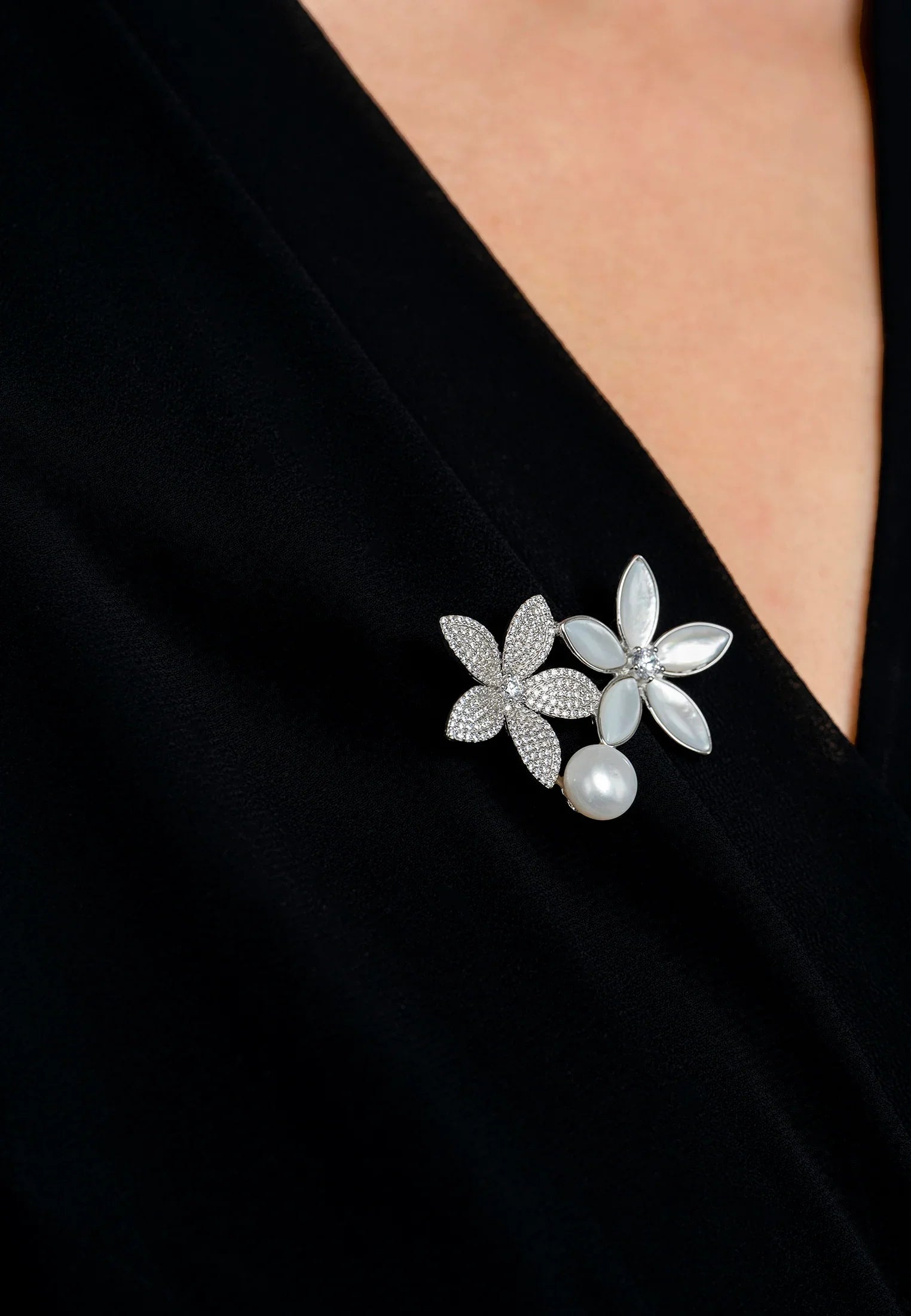 The brooch worn by a model.