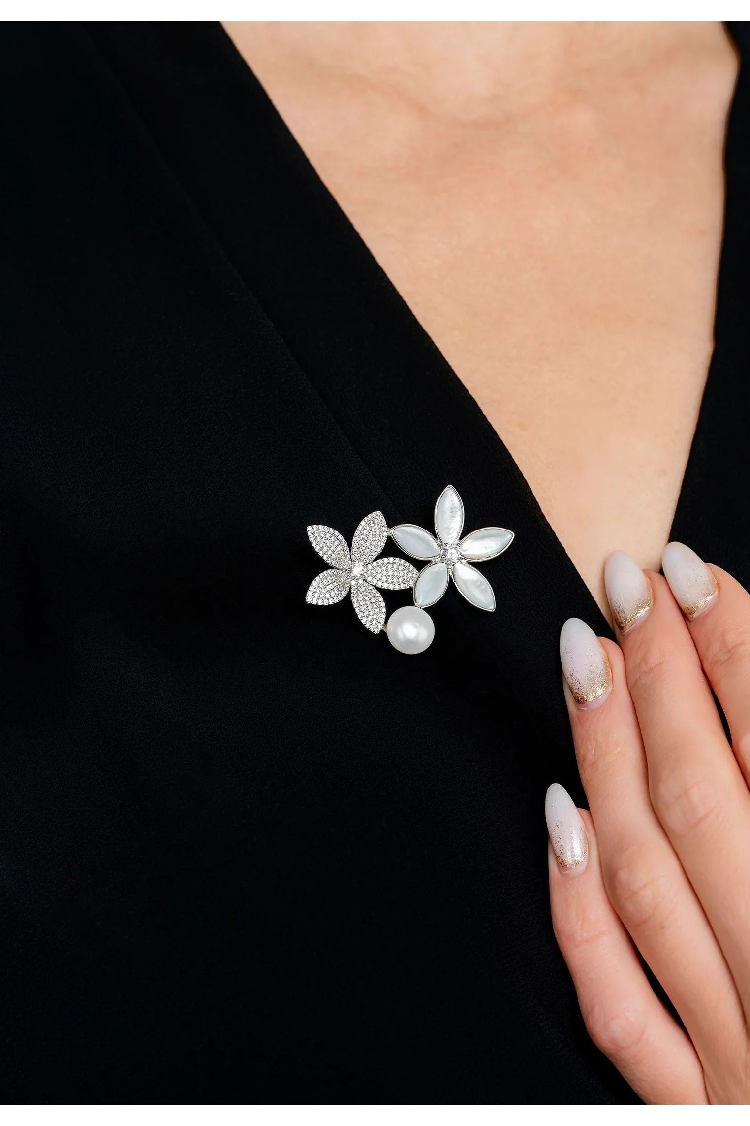 The brooch worn by a model.