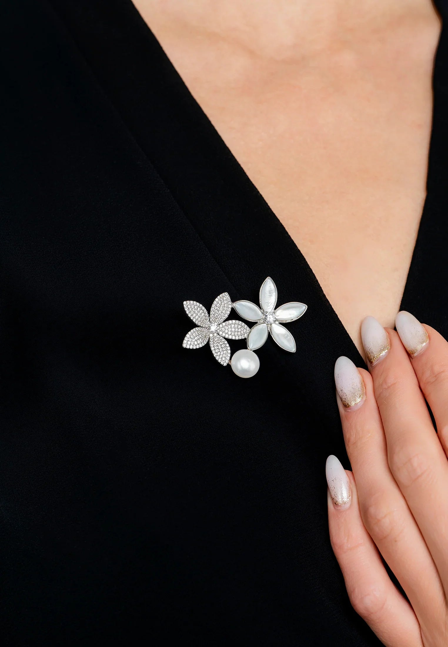 The brooch worn by a model.
