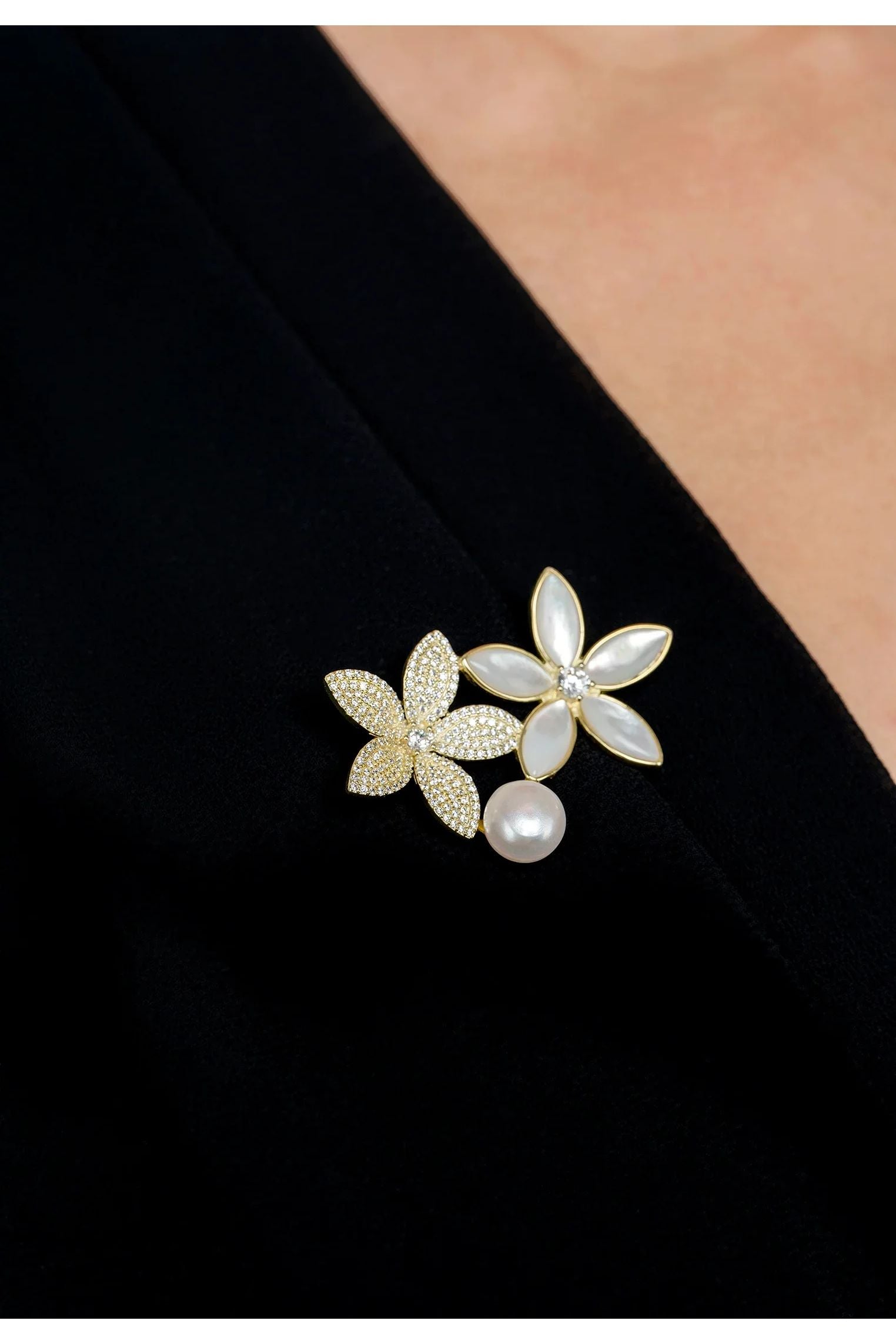 The brooch worn by a model.