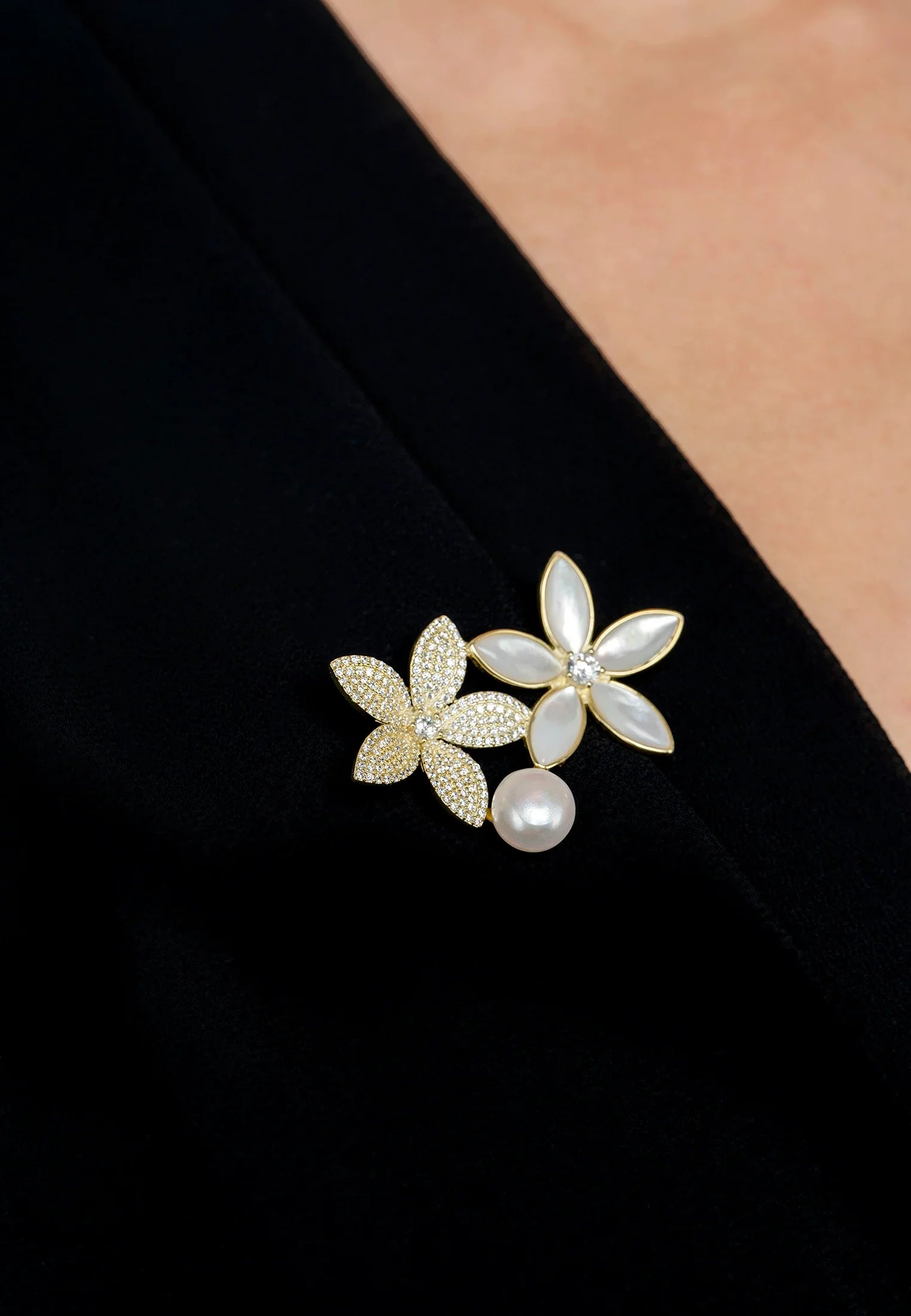 The brooch worn by a model.