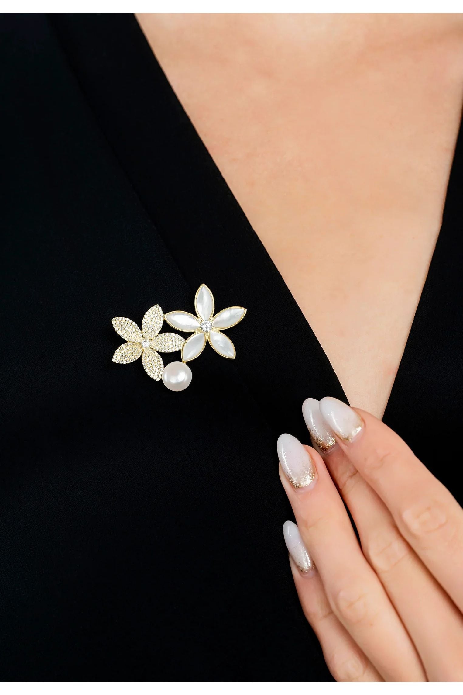 The brooch worn by a model.