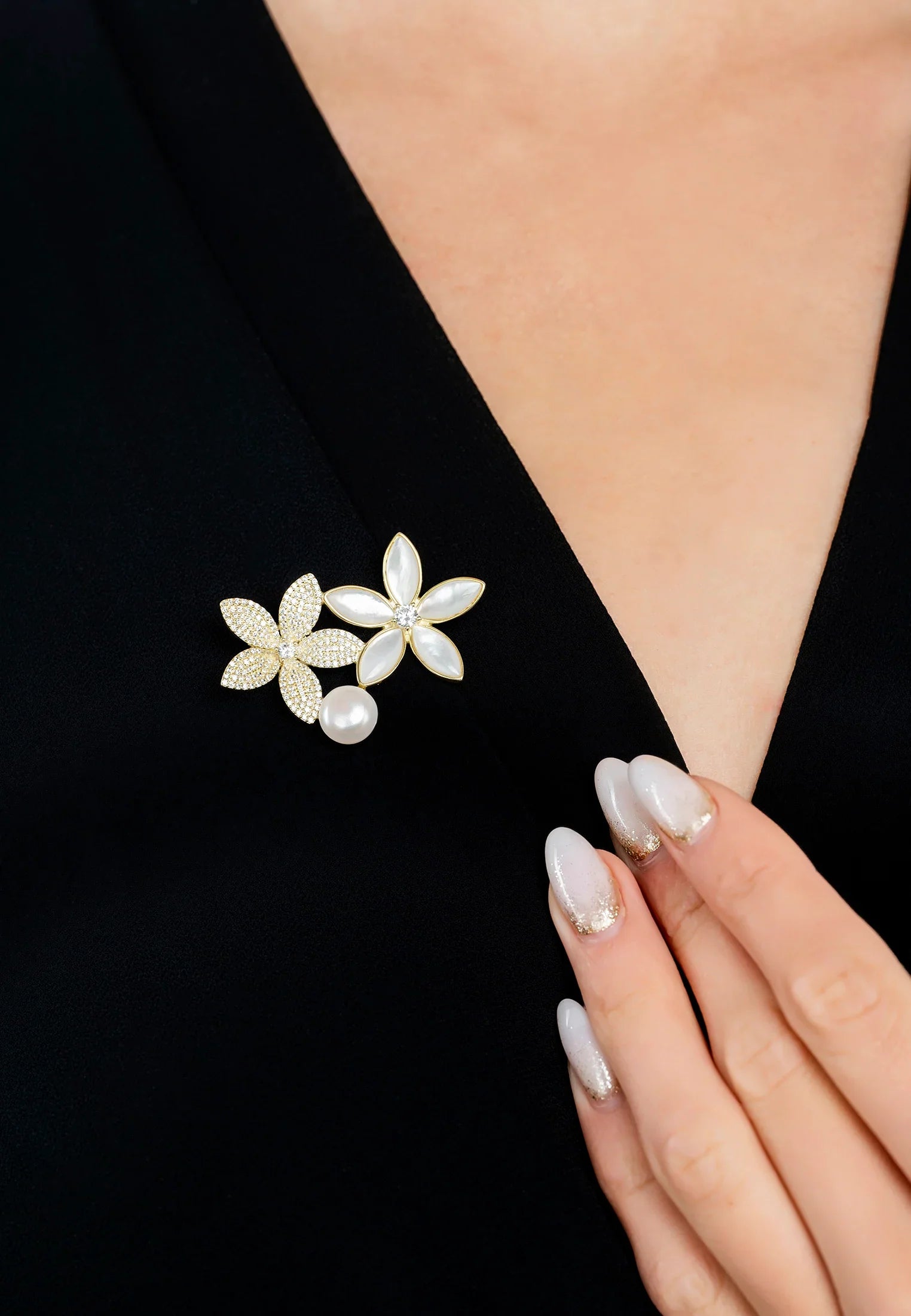 The brooch worn by a model.