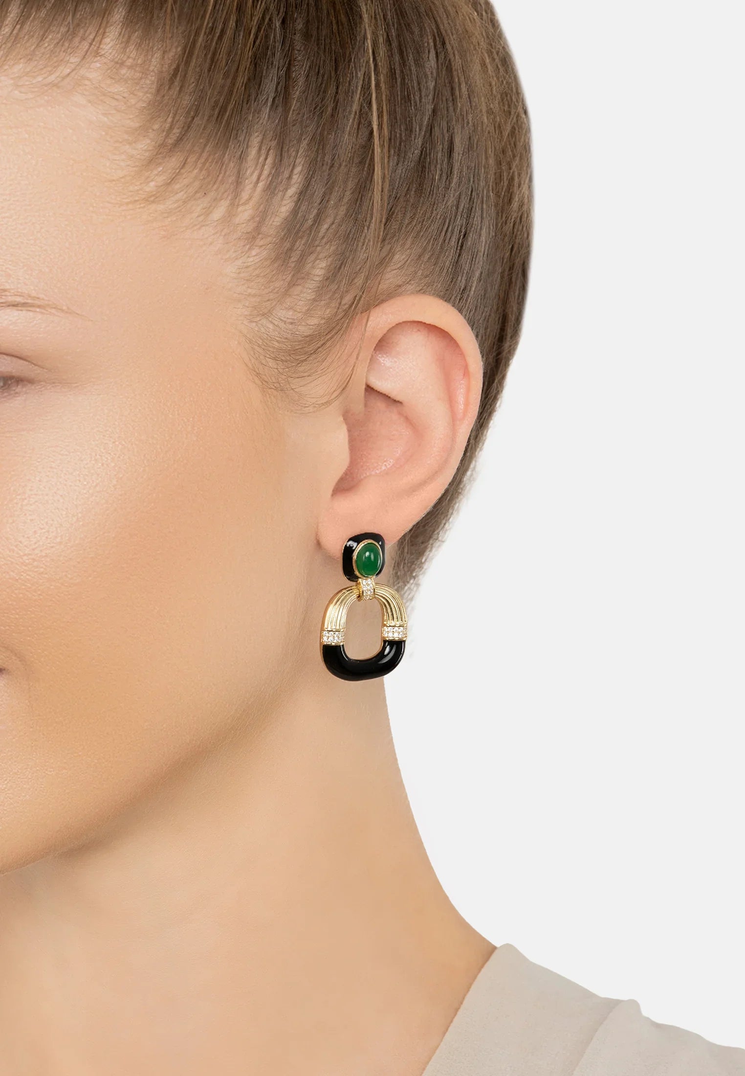 The earring worn by a model.