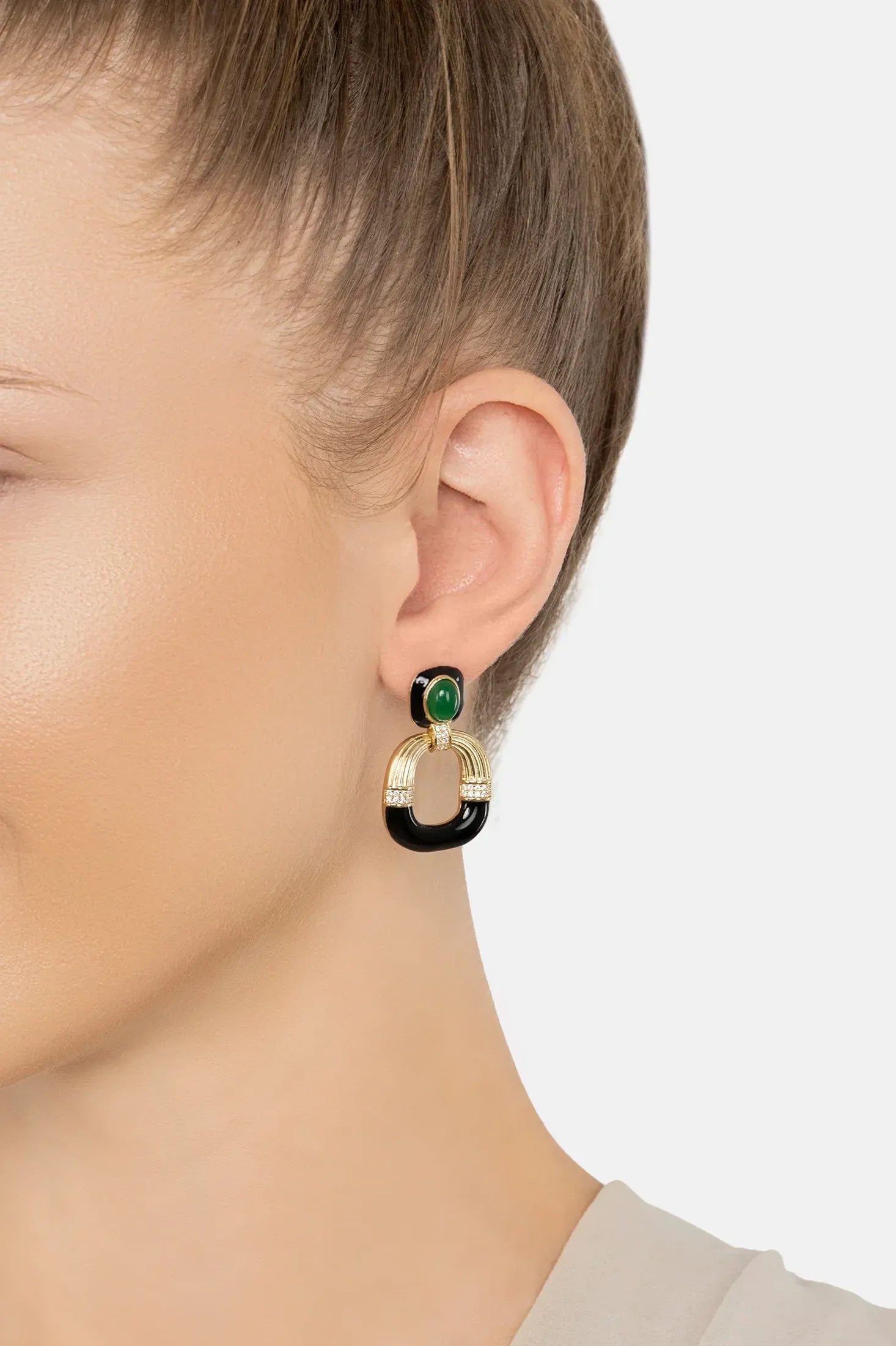The earring worn by a model.