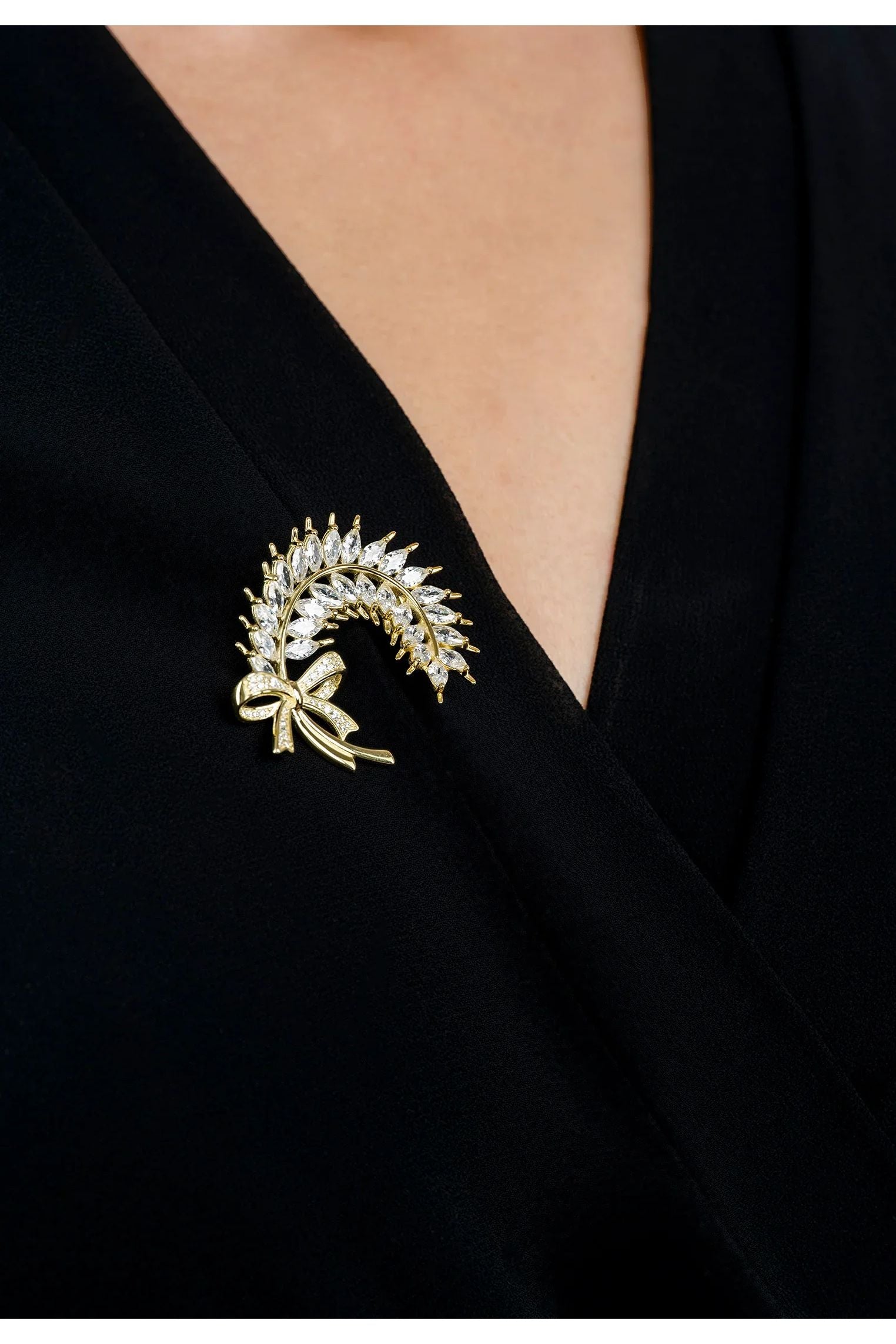 The brooch worn by a model.