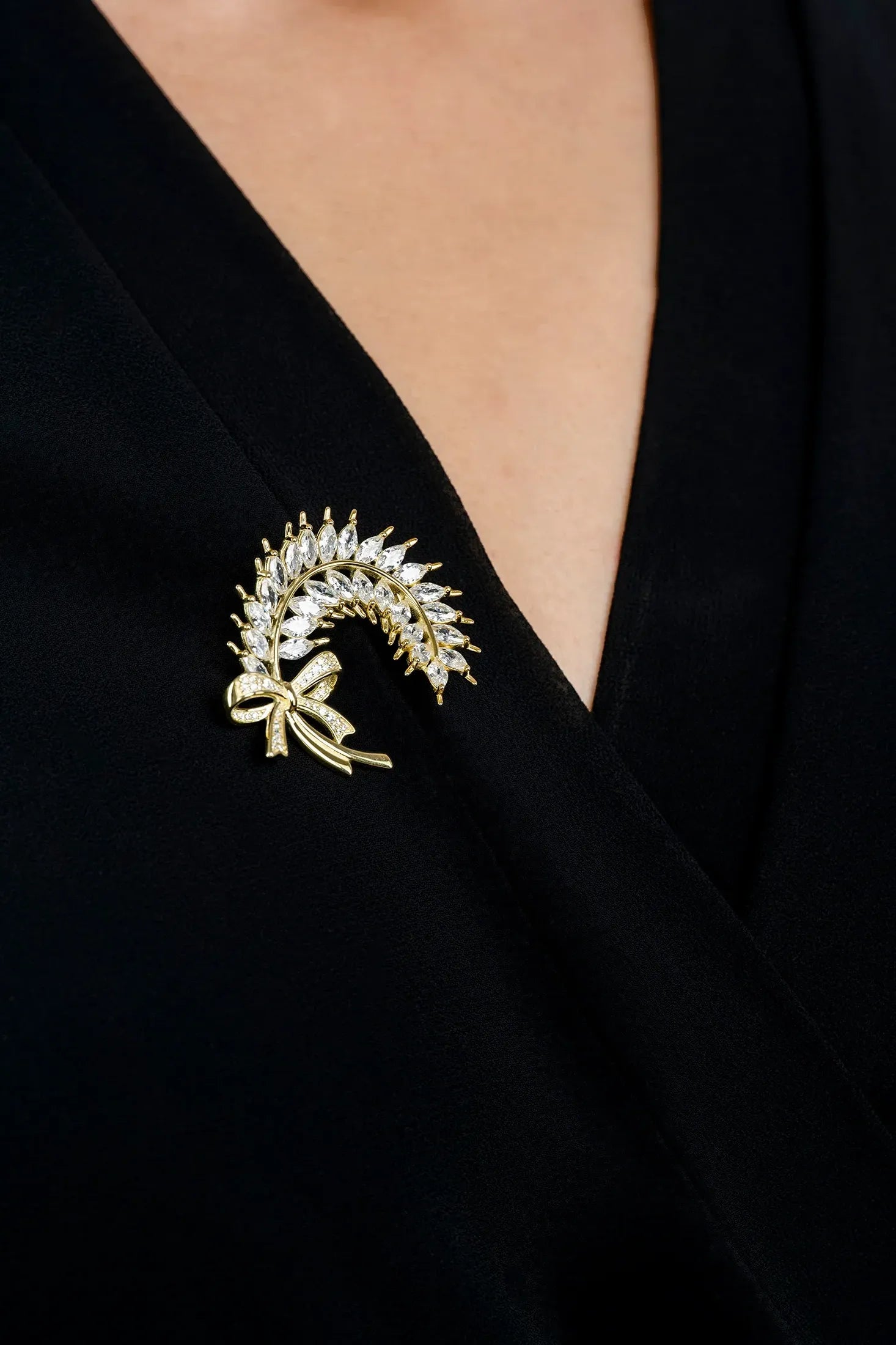 The brooch worn by a model.