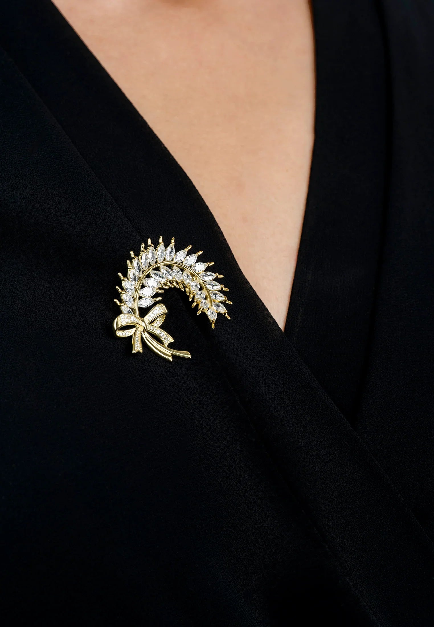 The brooch worn by a model.