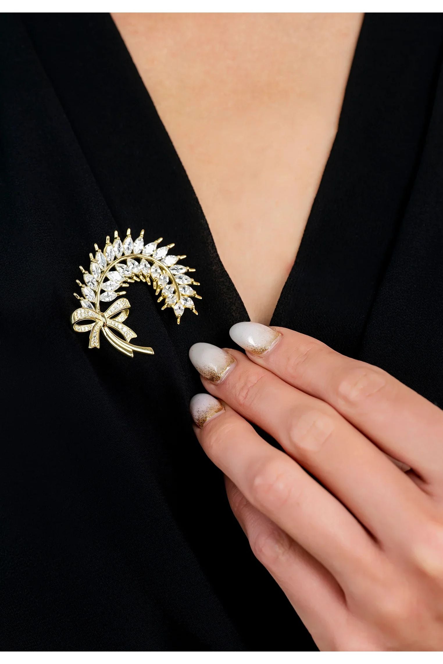 The brooch worn by a model.