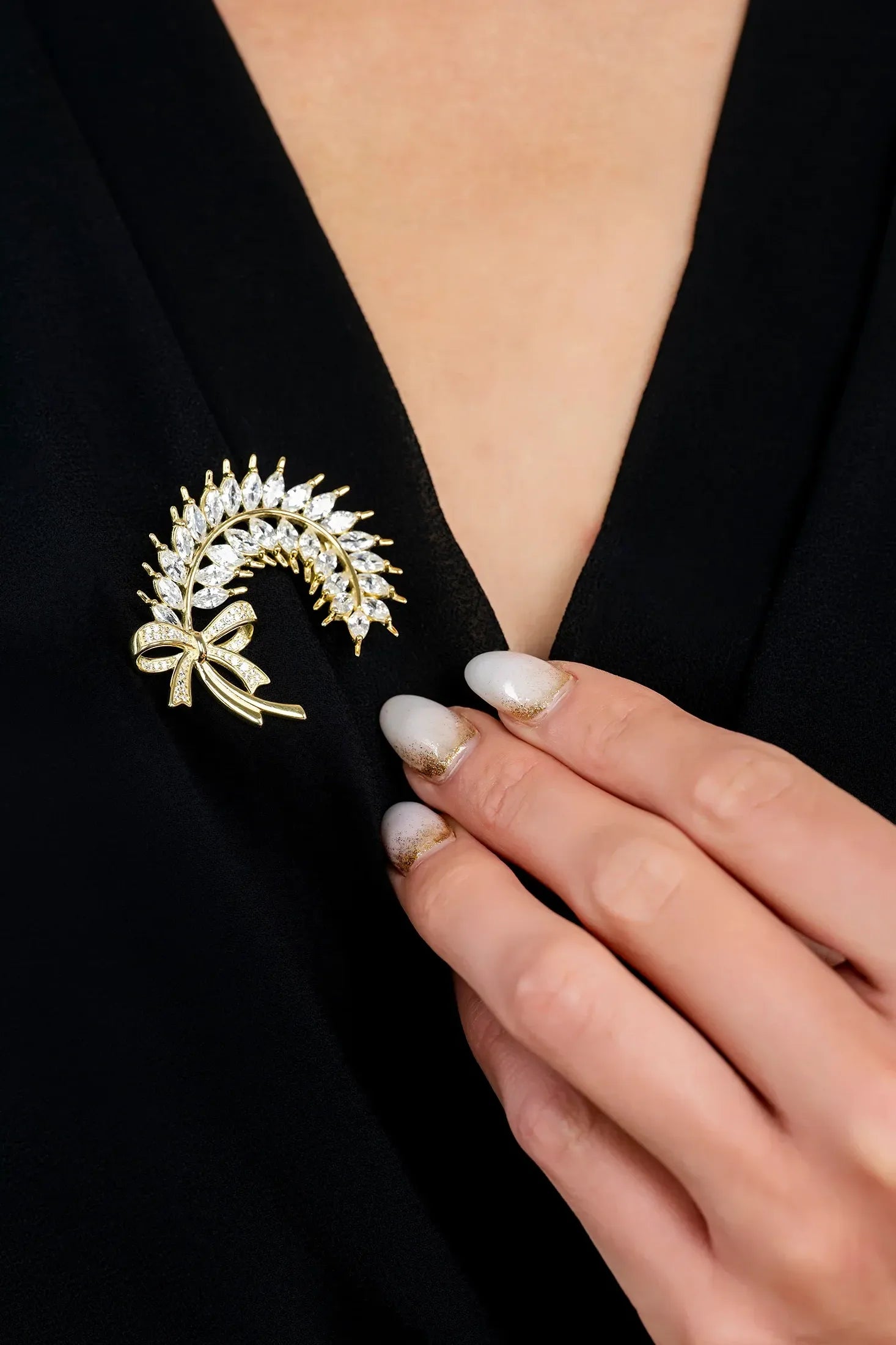 The brooch worn by a model.