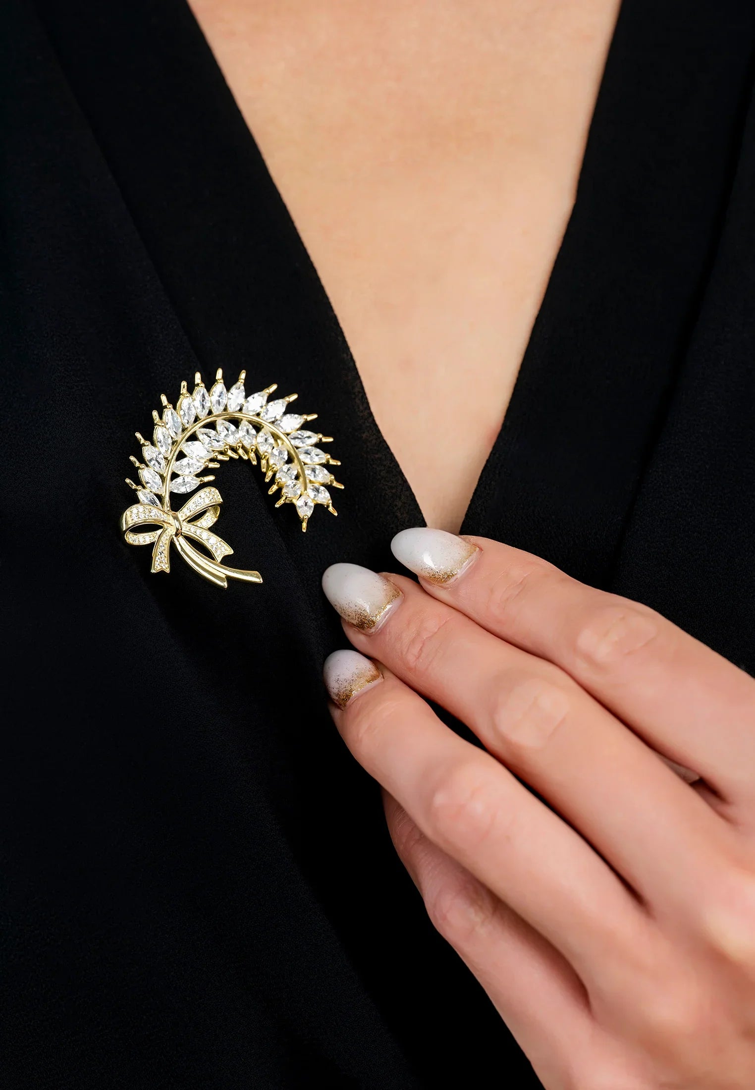 The brooch worn by a model.