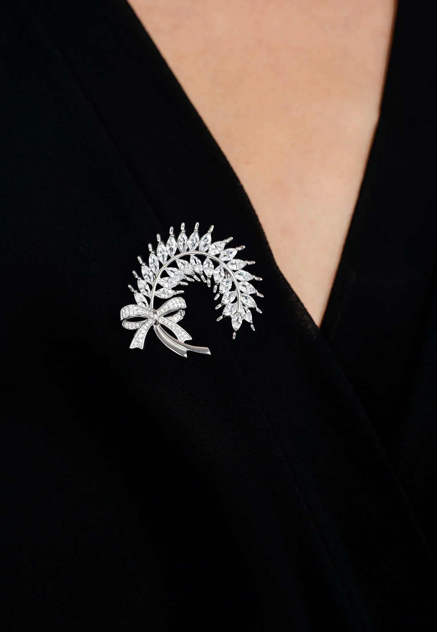 The brooch worn by a model.