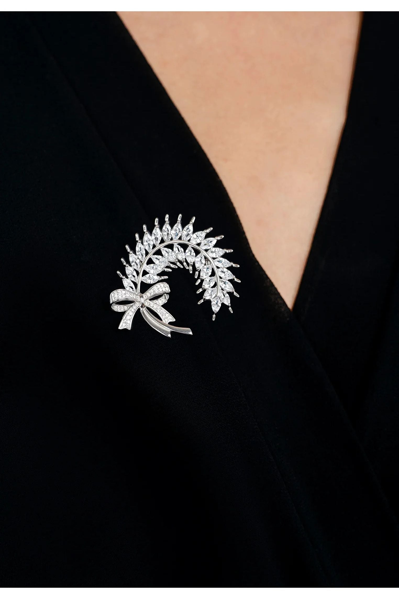 The brooch worn by a model.