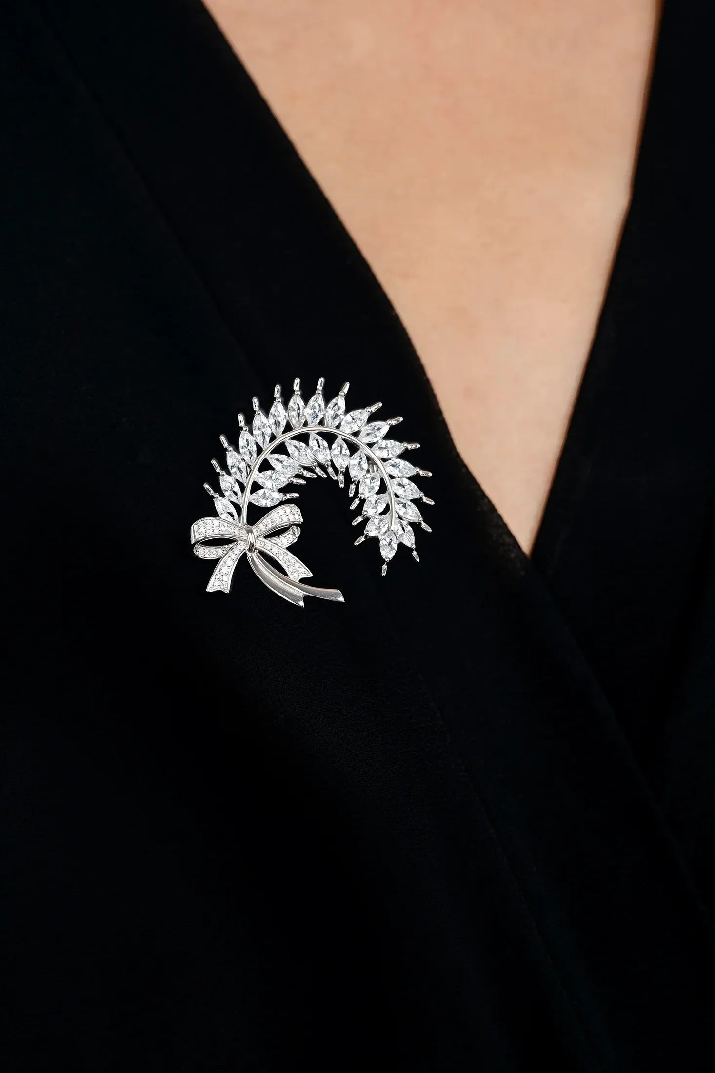 The brooch worn by a model.